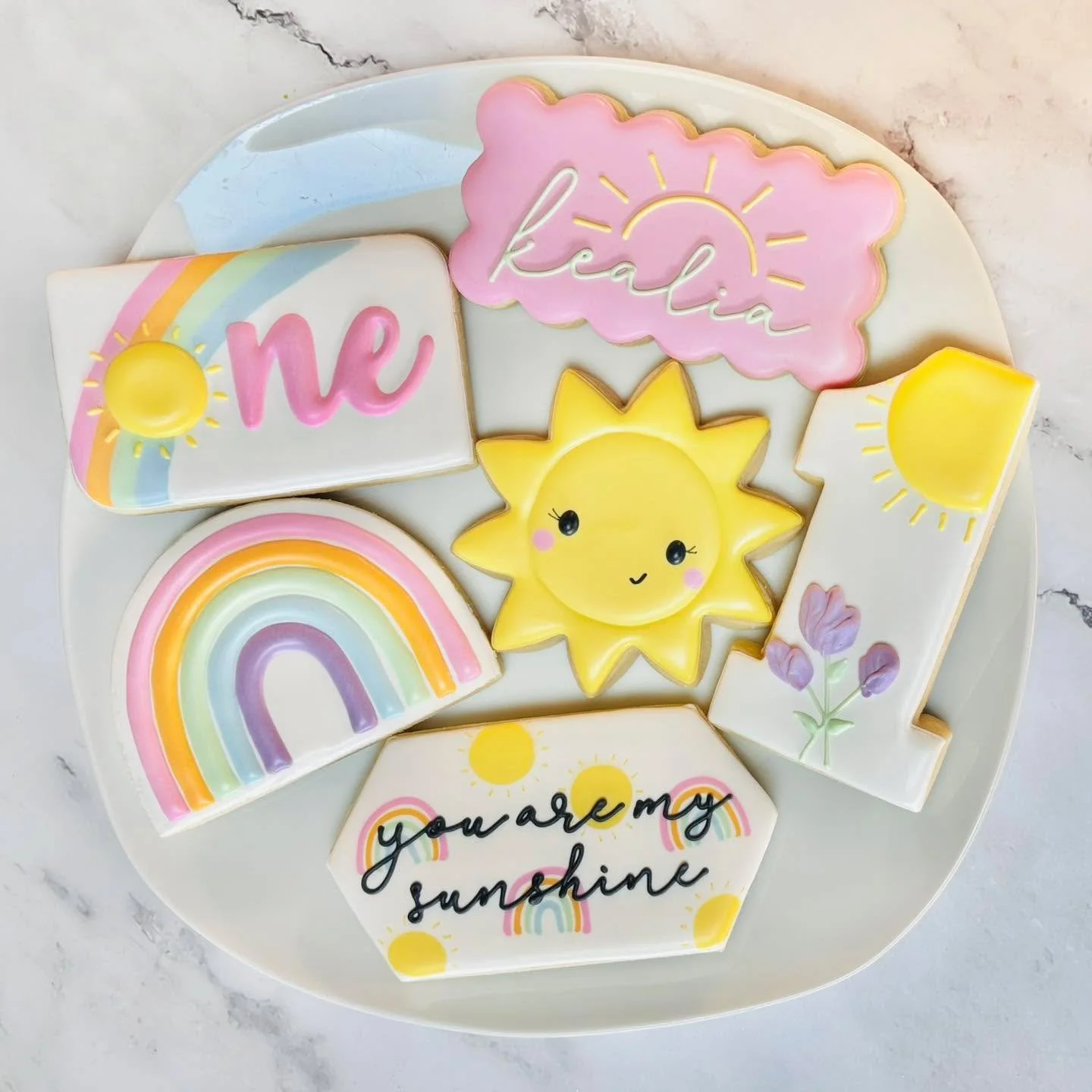 Cookies for a first birthday celebration! 🎉☀️🌈
.
.
.
. 
#firstbirthday❤️ #thisisone #firstbirthday #rainbowbaby🌈 #youaremysunshine☀️ #happybirthday #happybirthdaycookies #birthdaycookies #birthdaytreats #birthdaypartyfavors #partyfavors #momsofins