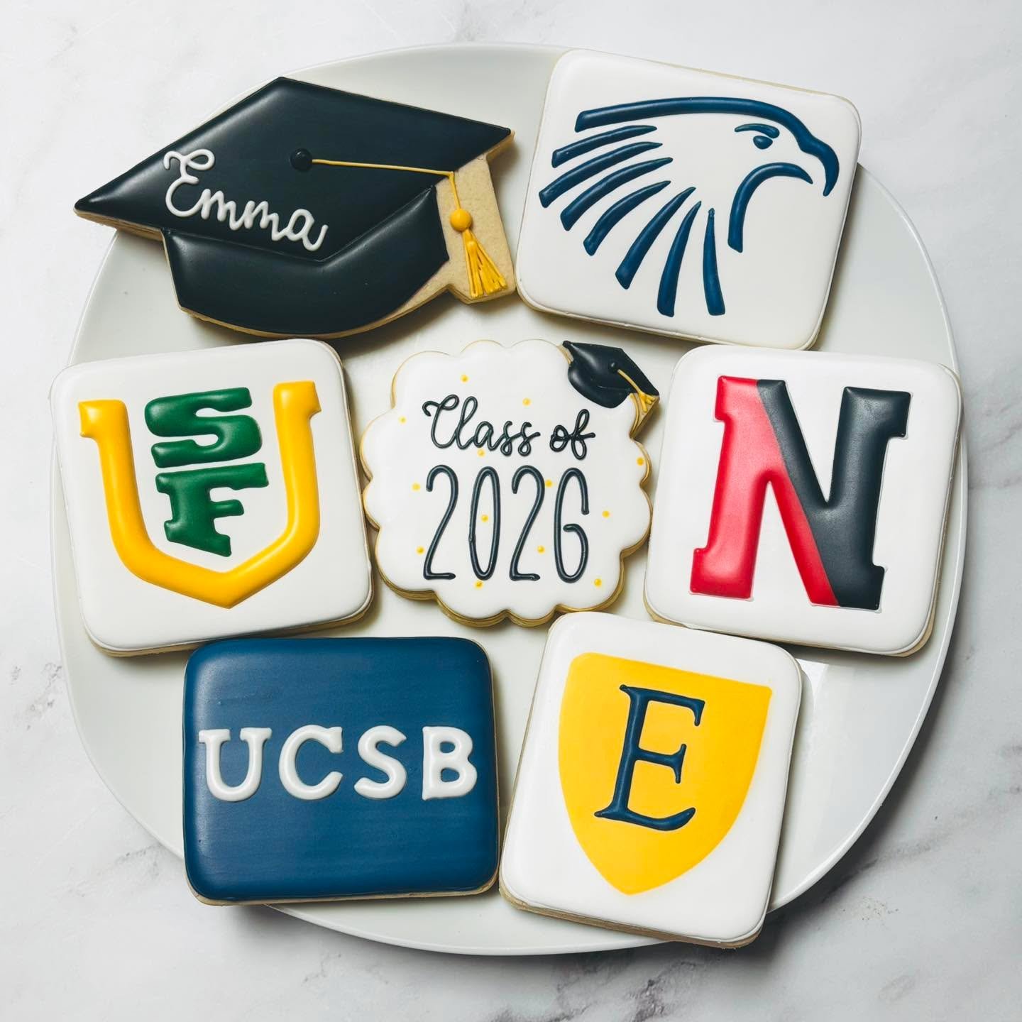 Kicking off graduation season with a group celebration for these grads! 🎉
.
.
.
.
#graduationcookies #royalicing #classof2026 #ucsb #usf #embryriddleaeronauticaluniversity #emoryuniversity #northeasternuniversity #royalicingcookies #cookiefavors #de