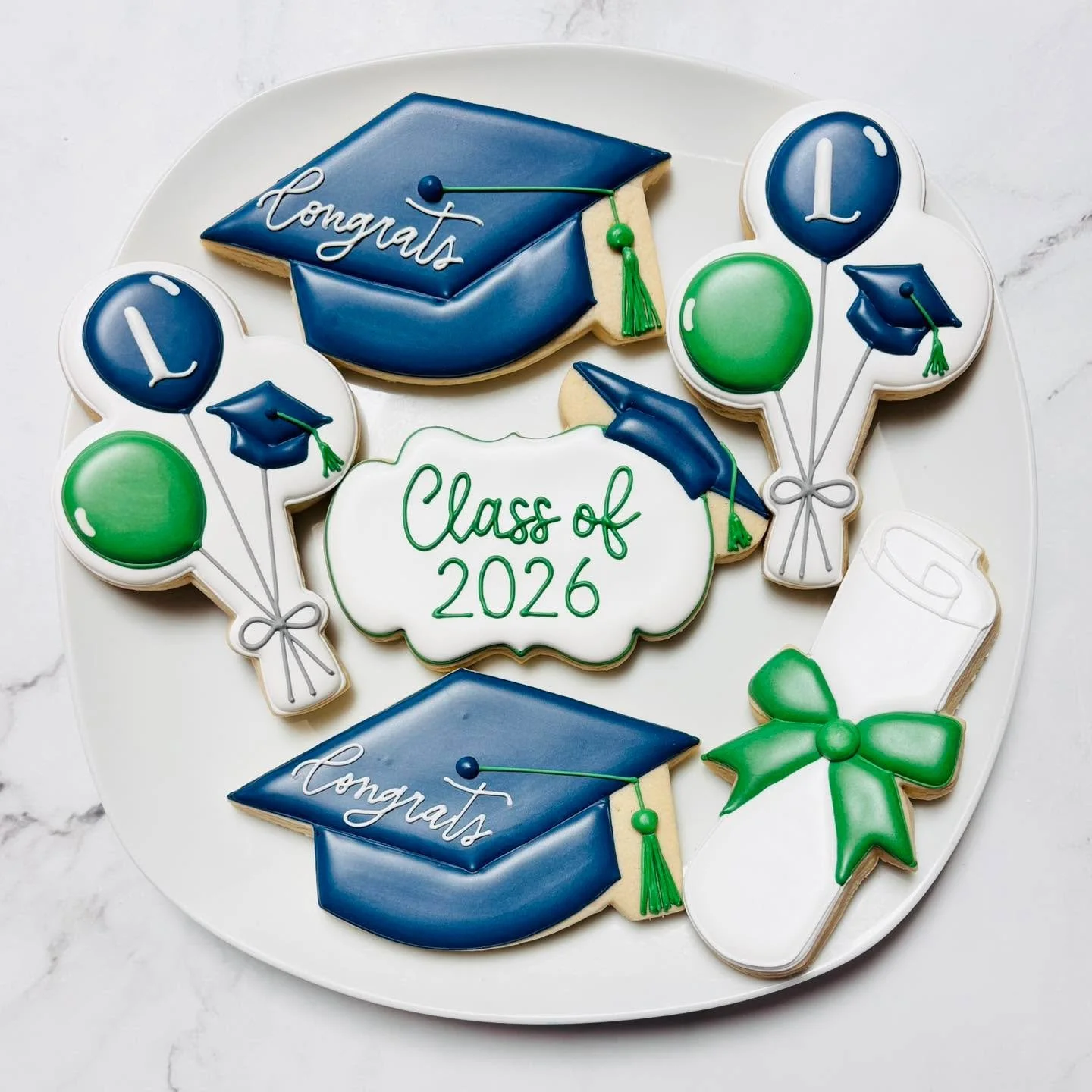 Oh, the places you&rsquo;ll go! 🎉
.
.
.
.
#graduationcookies #royalicing #classof2026 #royalicingcookies #cookiefavors #decoratedsugarcookies #customcookies #lovesweets #sugarart #sugarcraft #edibleart #cookieart #instabake #instasweet #sugarcookies