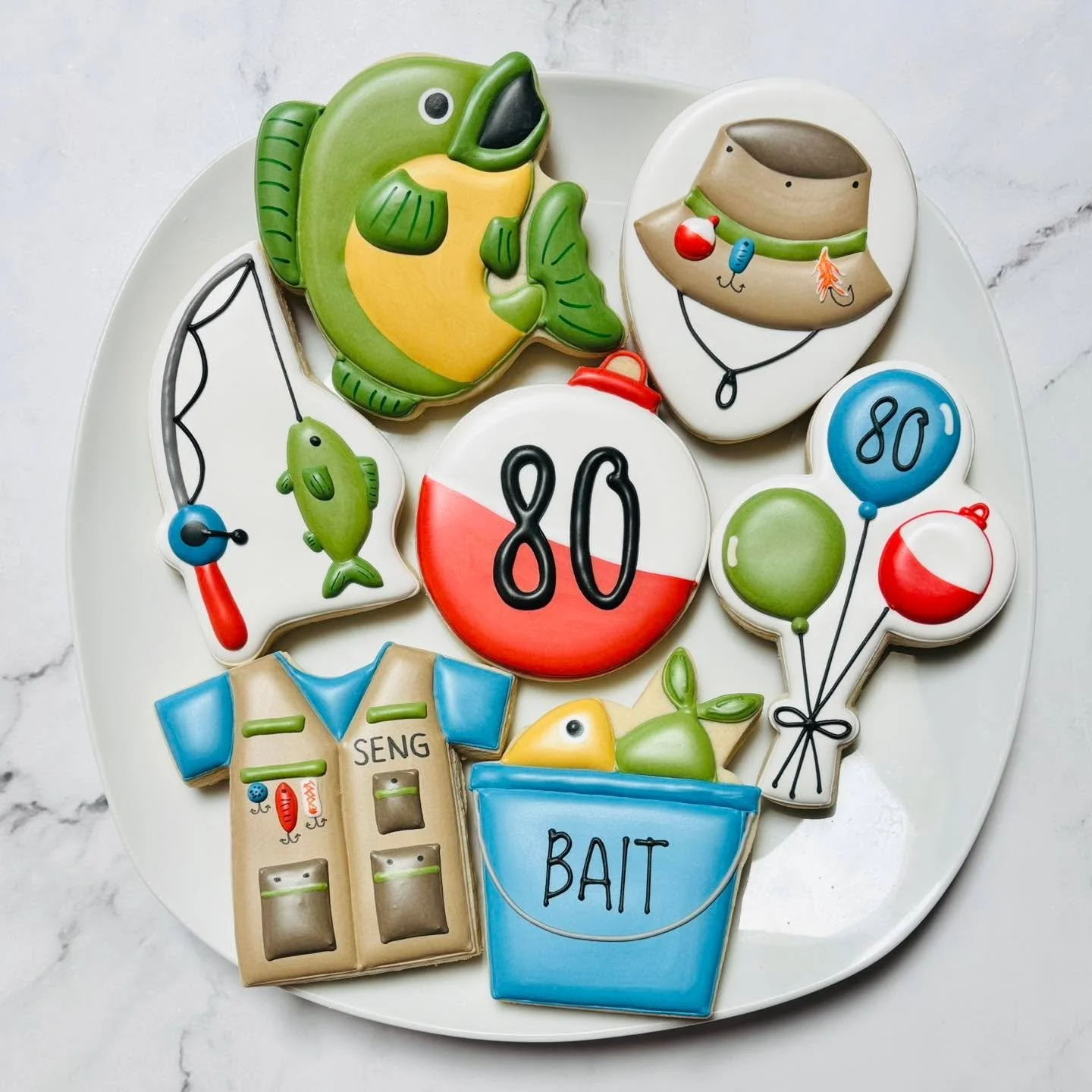 Fishing cookies for an 80th birthday celebration! 🎉🎣
.
.
.
. 
#fishingcookies #fishing🎣 #thisis80  #happybirthday #happybirthdaycookies #birthdaycookies #birthdaytreats #birthdaypartyfavors #partyfavors #momsofinstagram #cookiefavors #royalicing #