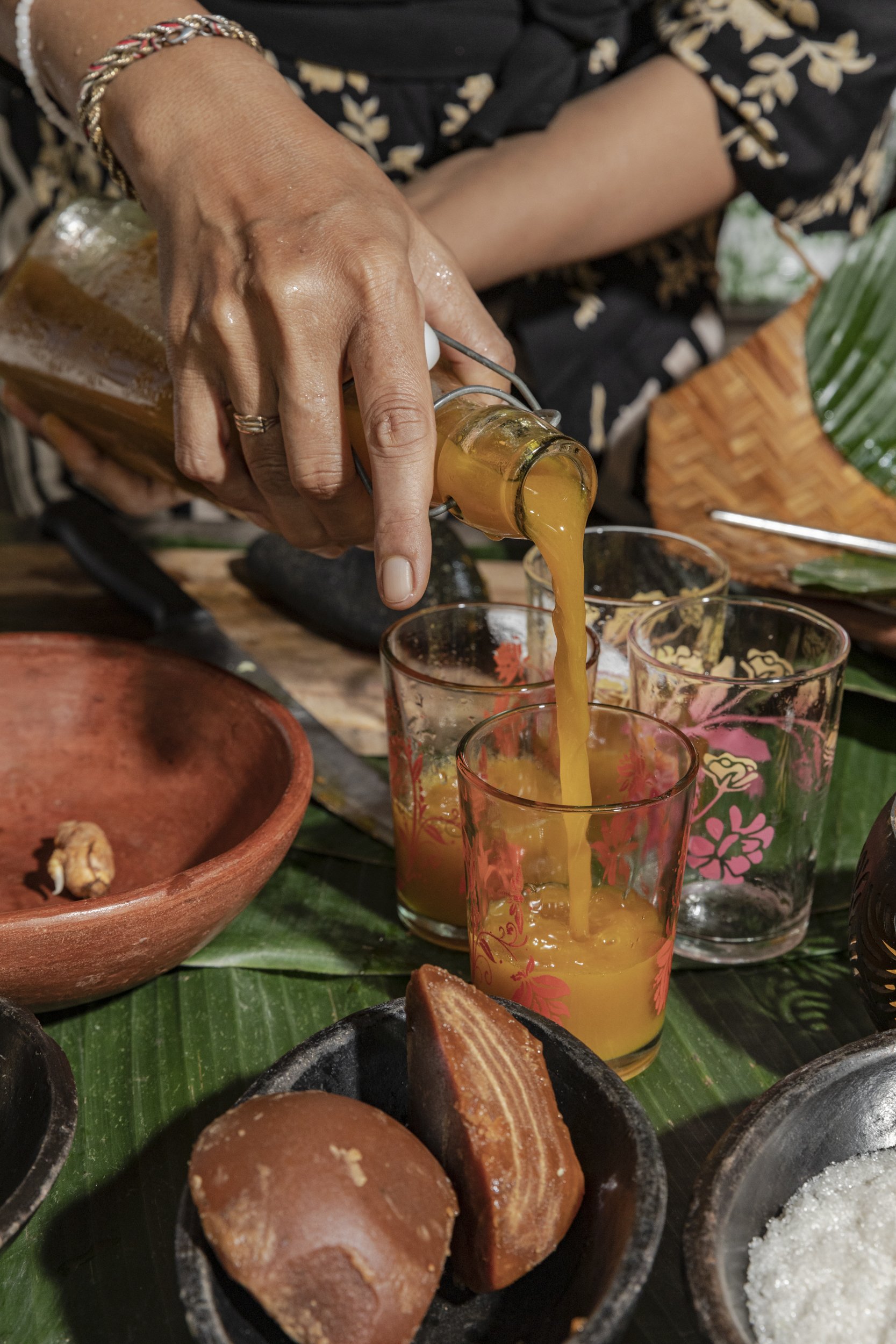  Jamu Kunyit Asam is being poured to try during Jamu making class at Tugu Hotel in Canggu, Bali, Indonesia. 