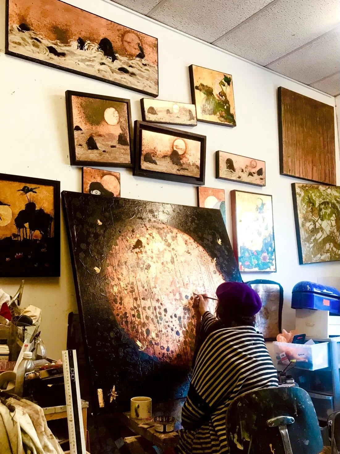 @teresartepoole working on her wondrous moon painting, which is about to be in the summer exhibition at @circusartgallery . If you swipe to the second pic the mysterious object Teresa is holding is a clove of garlic, which apparently can be used to p