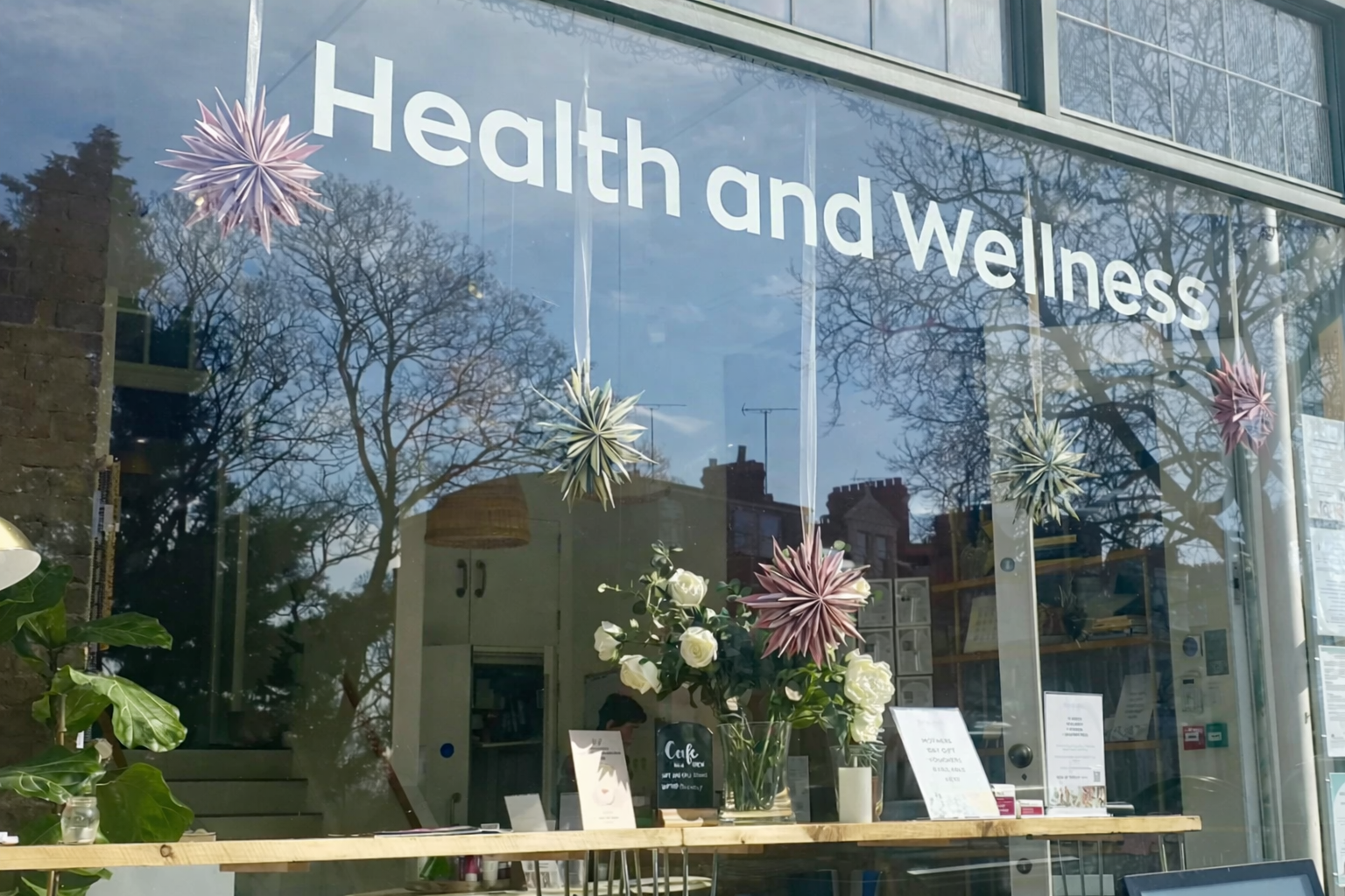 Health and wellness practitioner supporting personalised mind-body healing session with calm, holistic approach