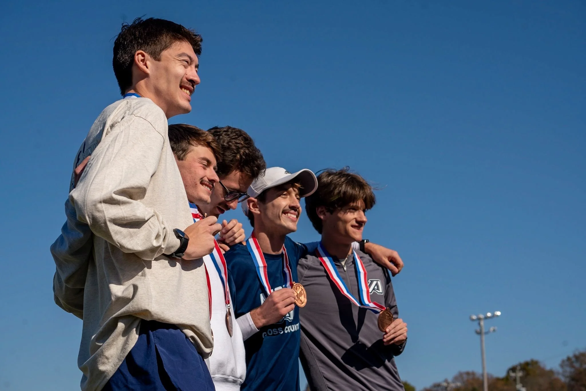 AU men's cross-country team qualifies for nationals in Seattle; women finish seventh in region