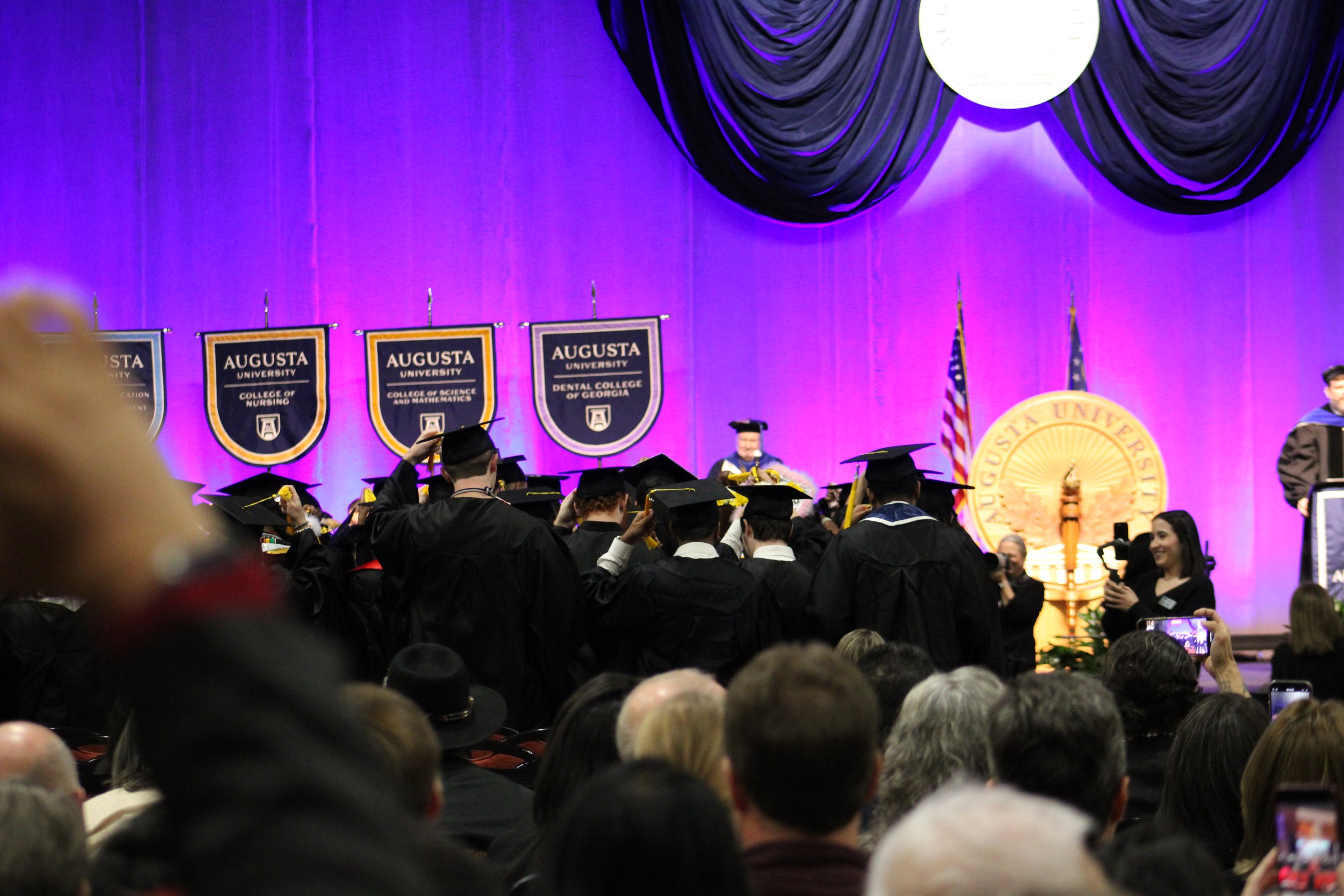  Graduates turn their tassels.  (photo by Rakiyah Lenon)  