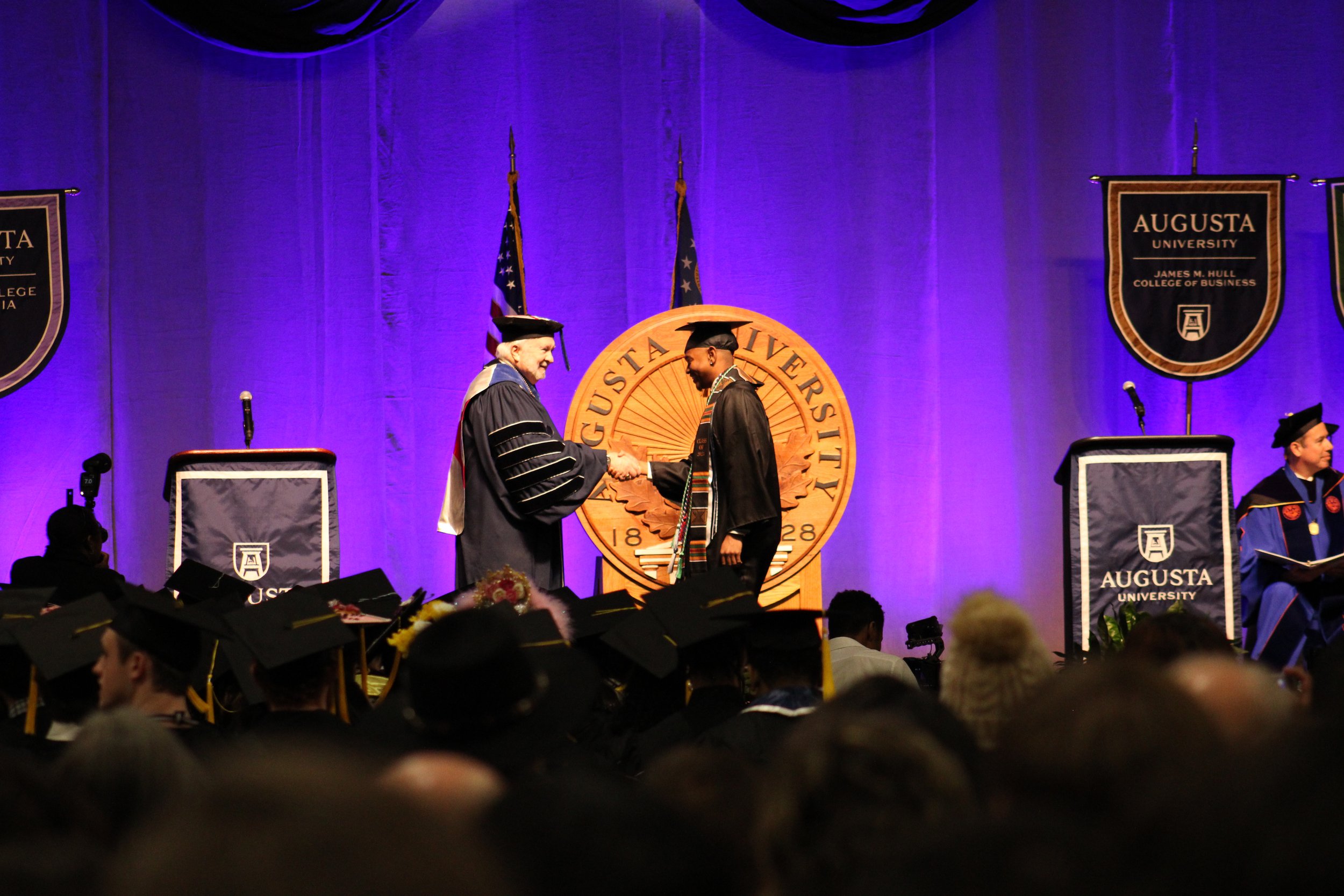  Student walks across the stage to receive his diploma.  (photo by Rakiyah Lenon)  