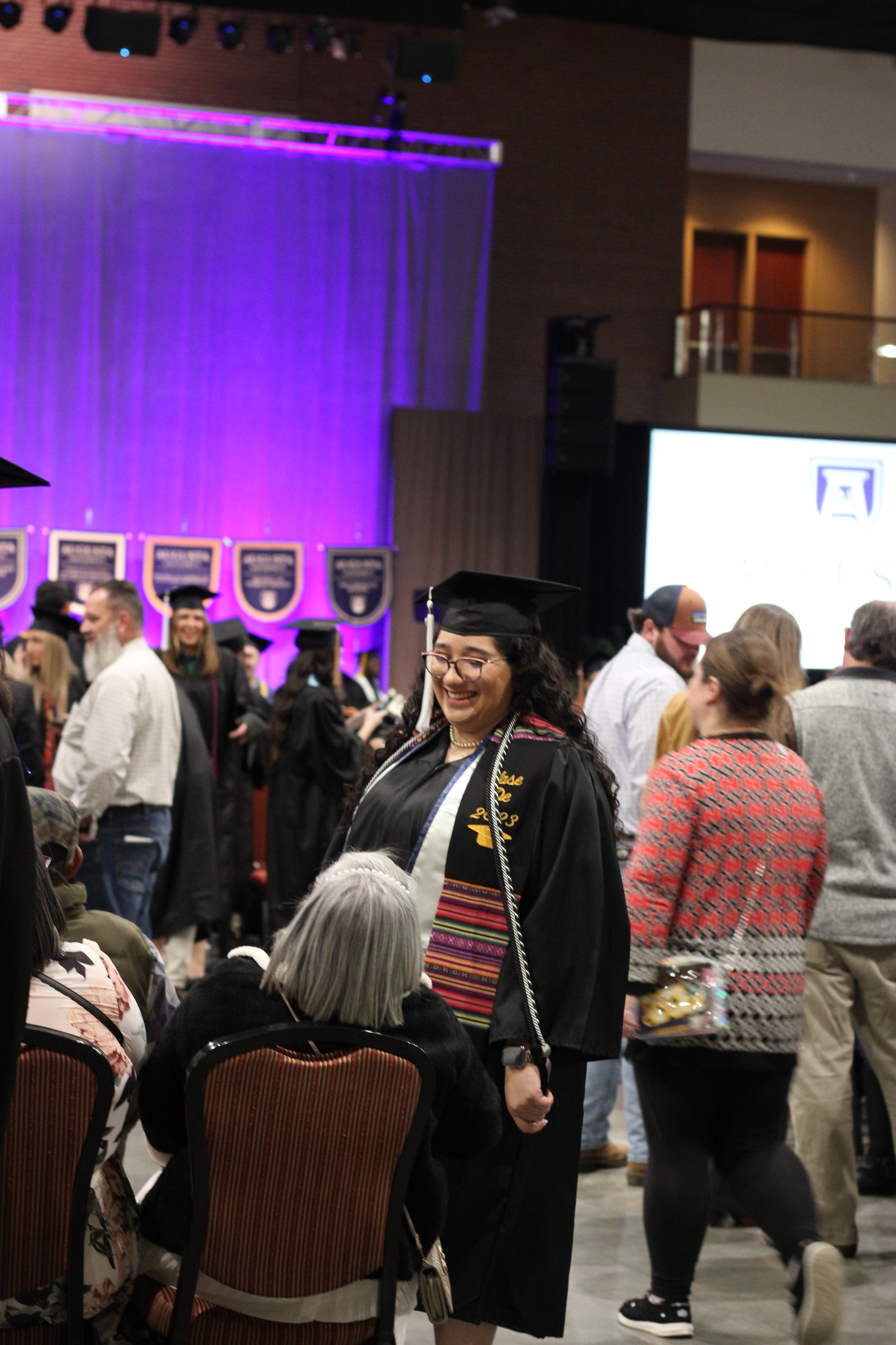  Students speak with their families at commencement.  (photo by Rakiyah Lenon)  