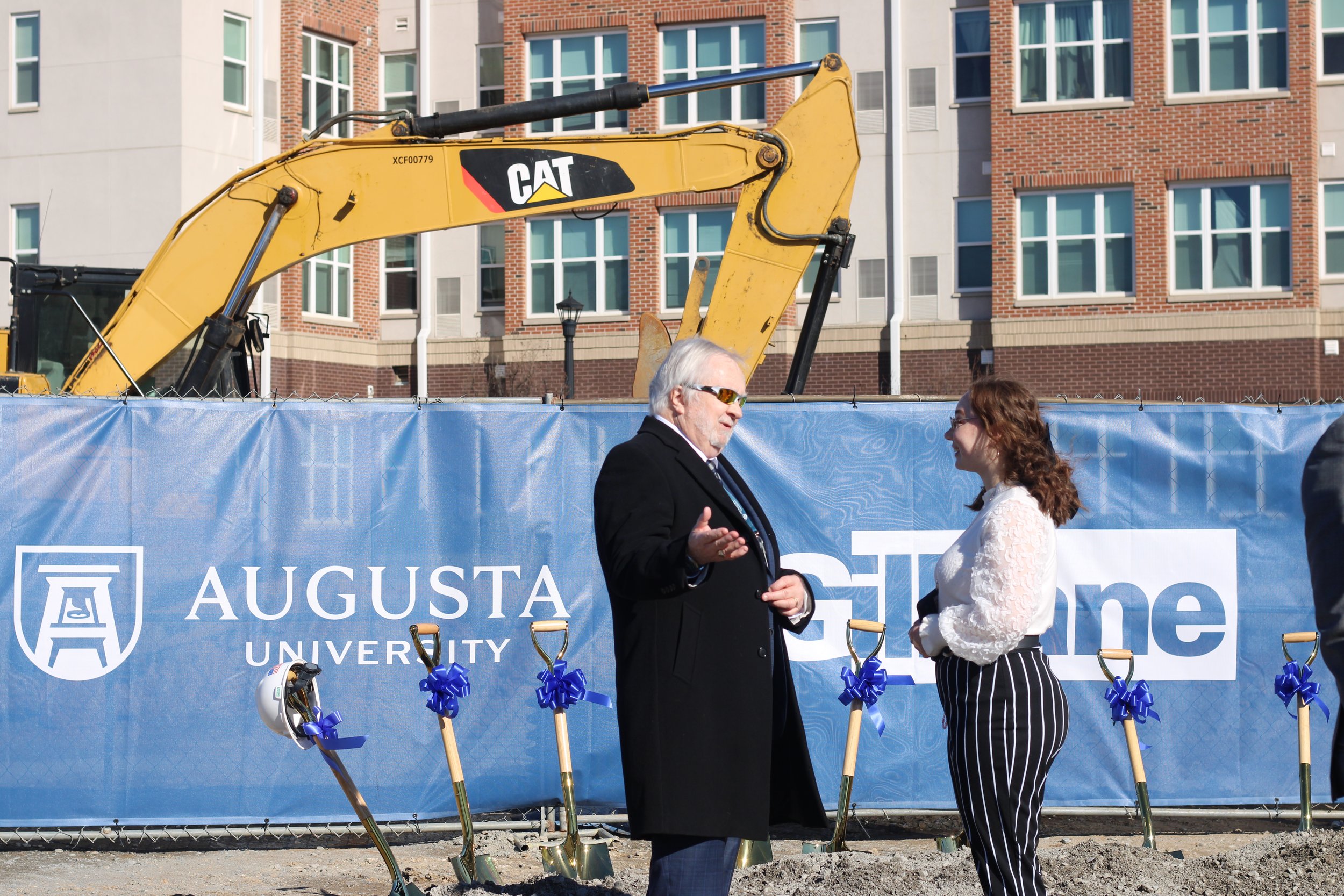  President Brooks Keel and Destiny Barrett chat after the groundbreaking ceremony on Jan. 29. 