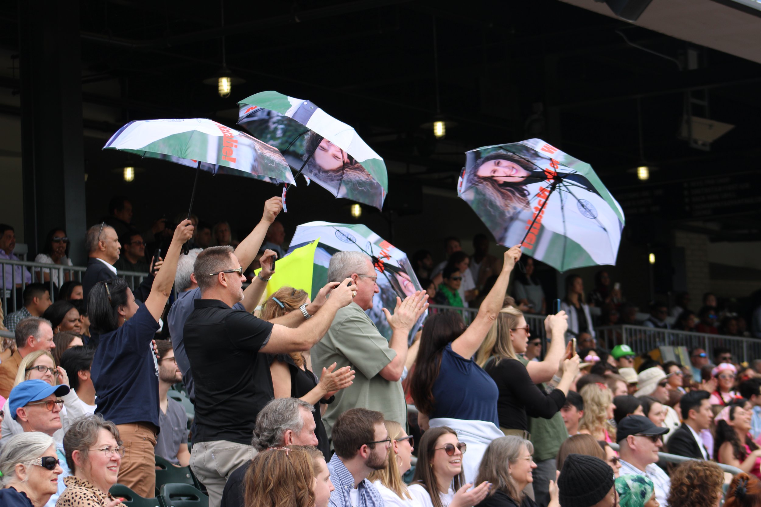  Supporters cheer with customized umbrellas at Match Day on March 15. 