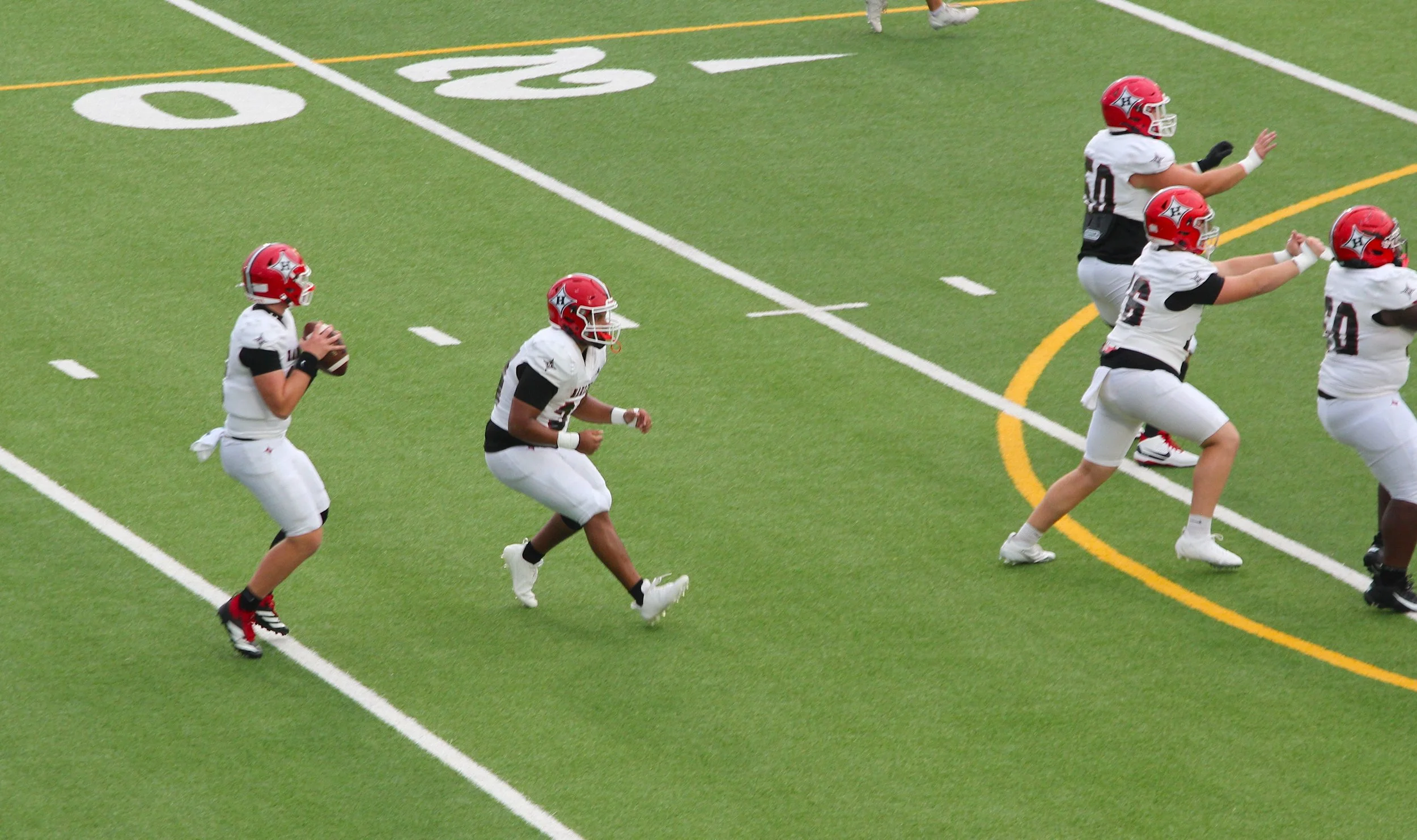 Running back Gault leads Evans High past Harlem 37-20 in season opener
