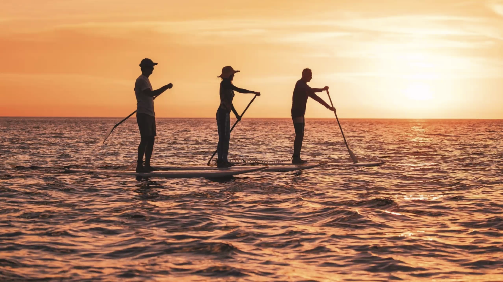 Sunset Trio of Standup Paddleboarders - March 2024.png