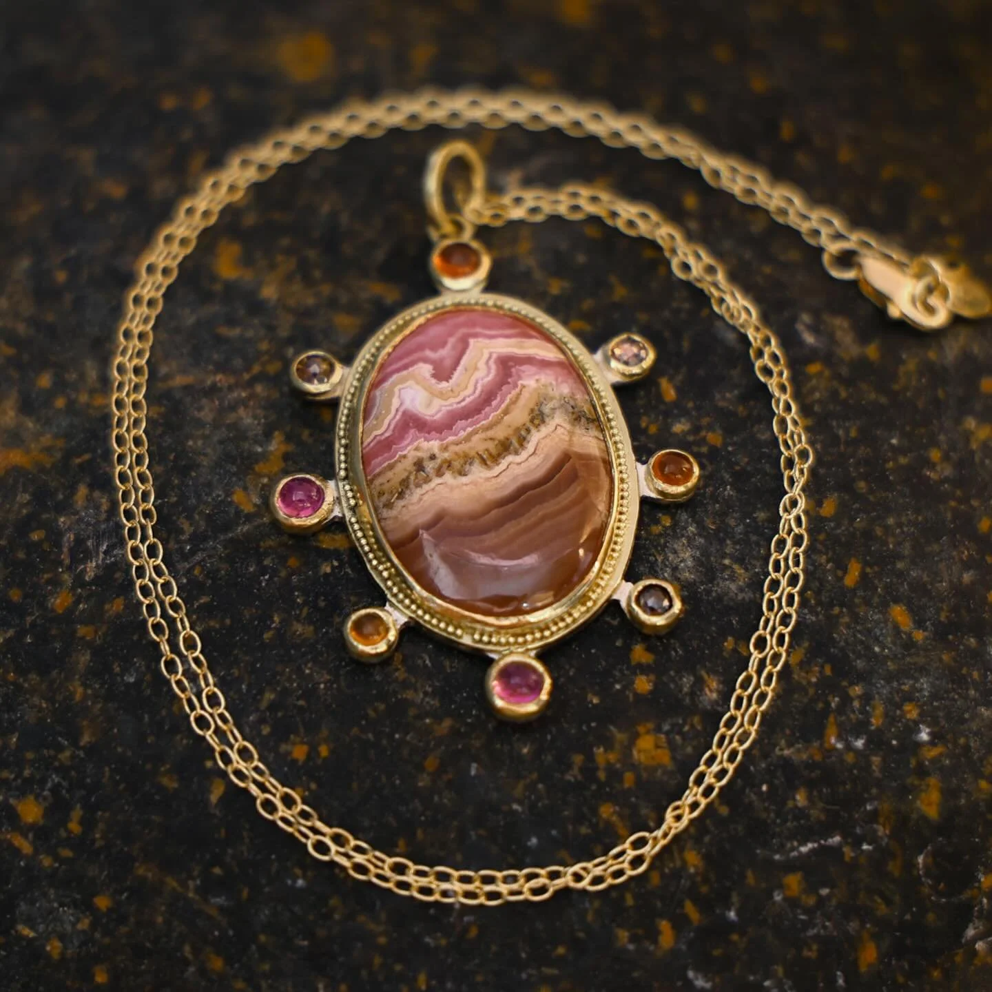 Known as the &ldquo;Stone of the Compassionate Heart&rdquo;, Rhodochrosite is thought to bring emotional balance to the wearer. I love the colors of this stone and combined it with the positive vibes of Spessartite Garnet, the soothing energy of Pink