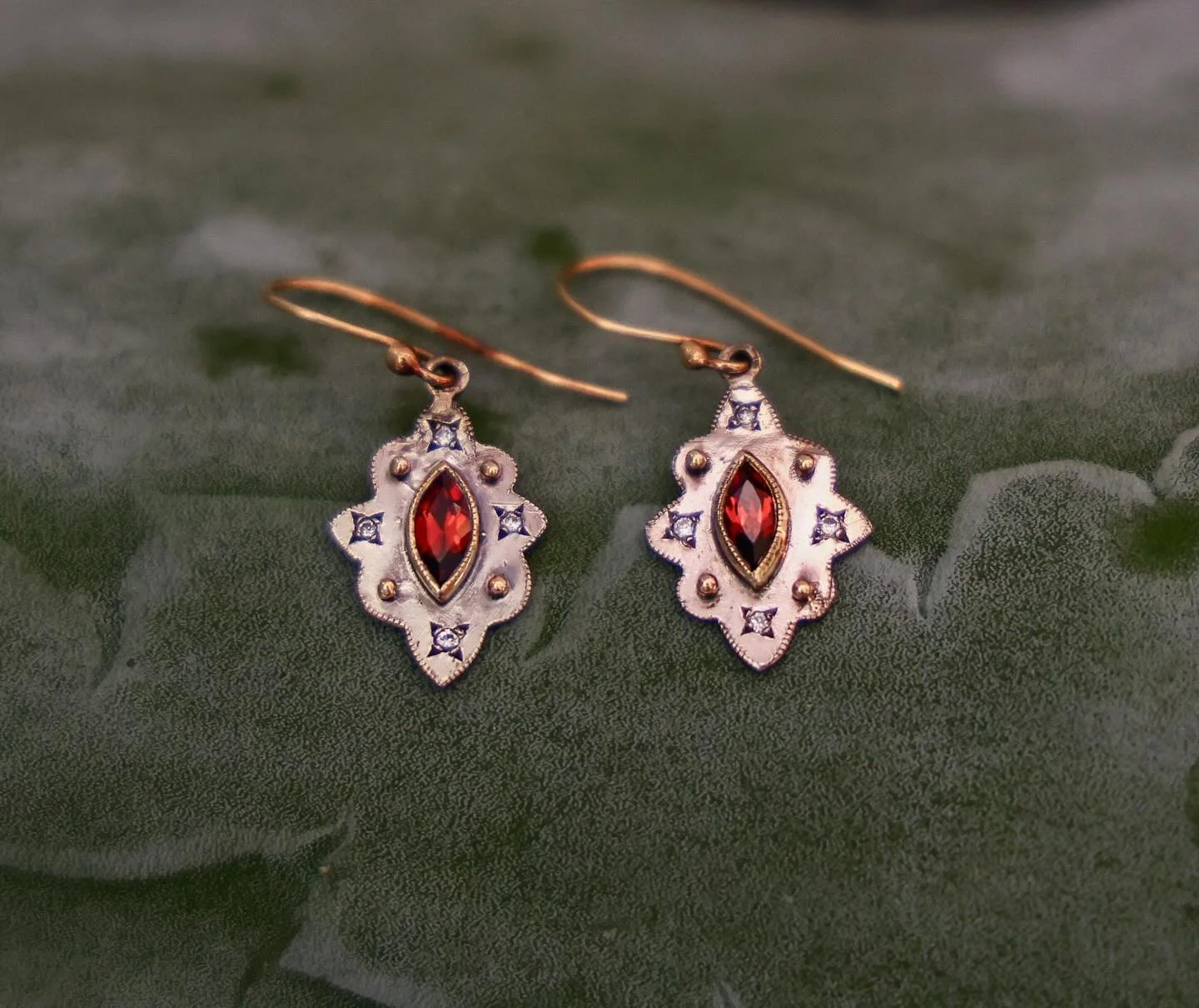 Morocco, red velvet, smoking incense- this is what I was imagining when I designed these beautiful little earrings. The rich red garnets are framed with 18k gold bezels on sterling silver. Decorated with white diamonds, 18k gold granules and 18k gold