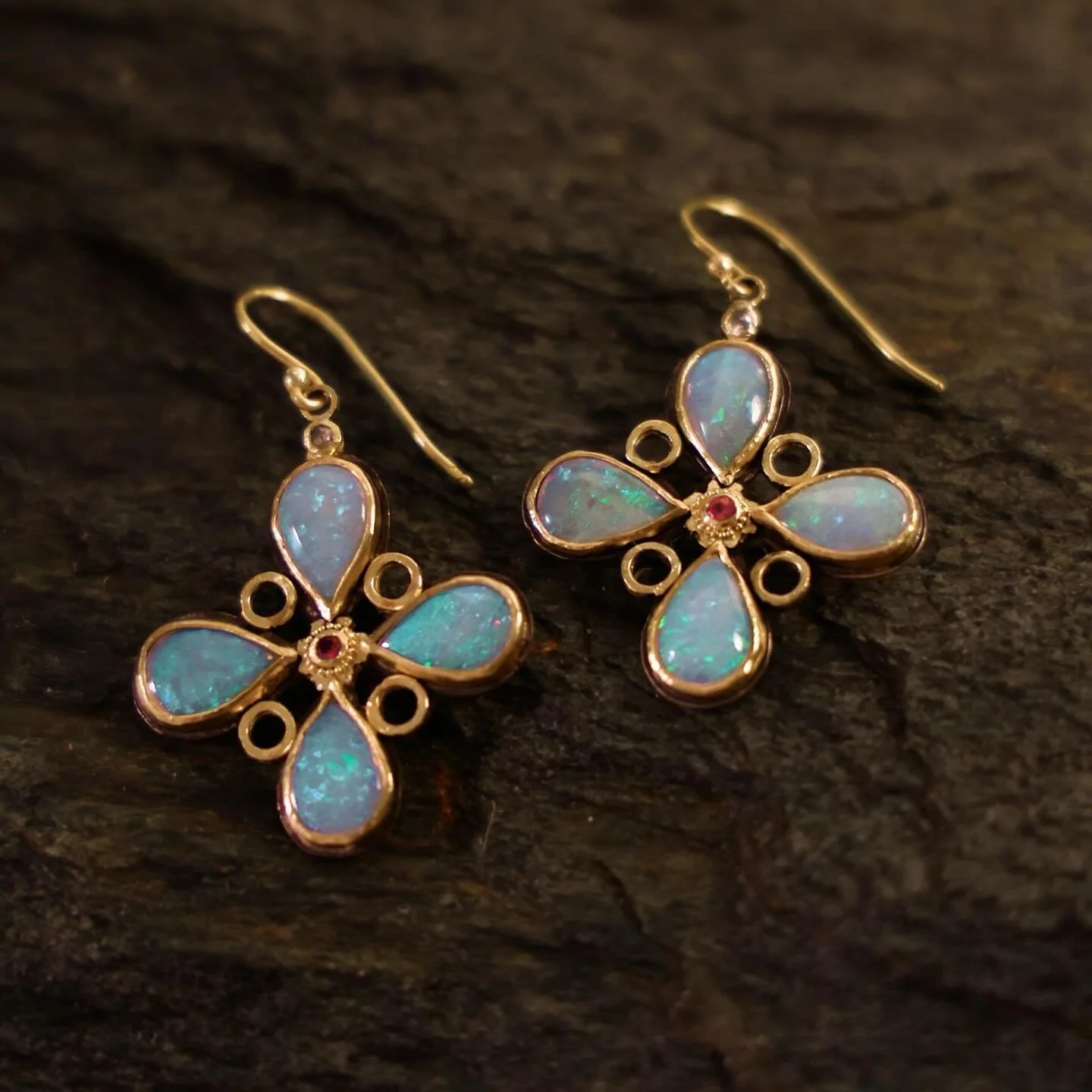 Opal, ruby and diamond earrings set in 18k gold ✨🩵 These Opals change color with the light. Usually they appear iridescent blue, sometimes there are flashes of red or green - but always very colorful. Opal &ndash;emotional flow &amp; creative light.