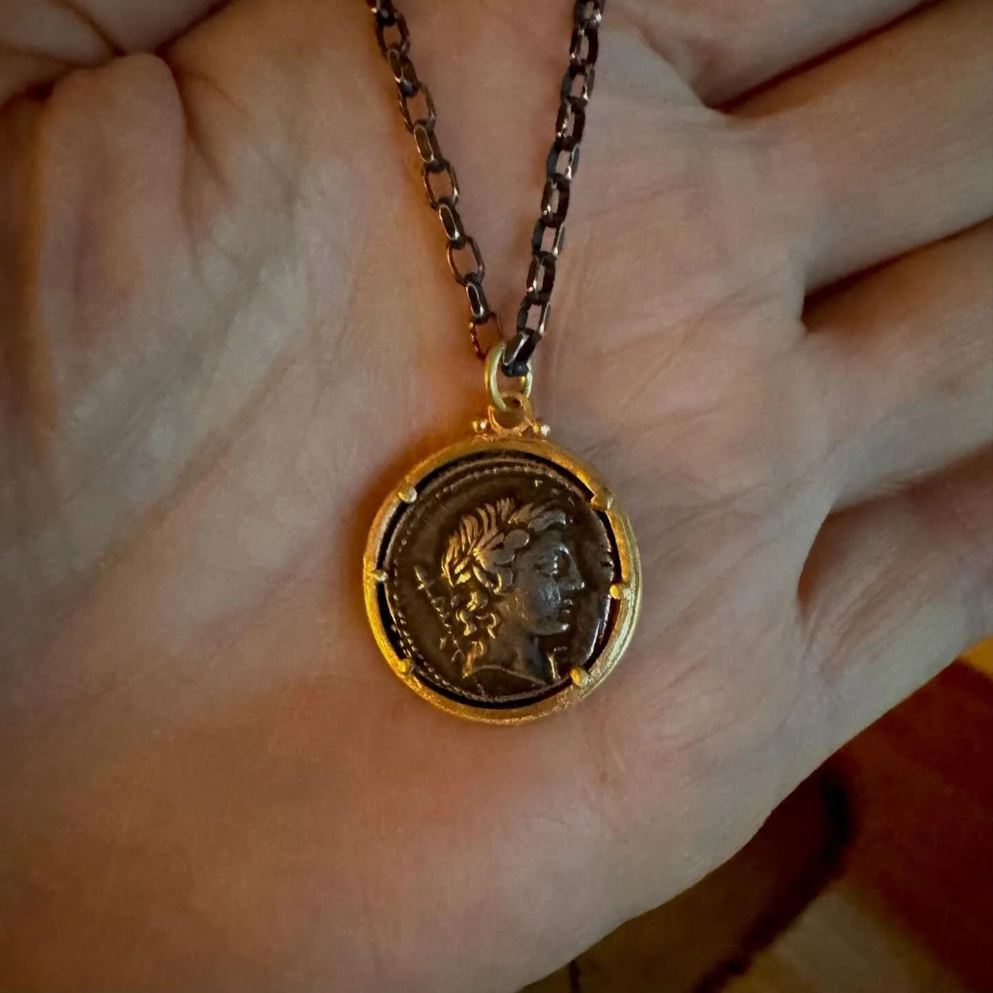 An ancient Roman coin depicting the god Apollo- Apollo represents the illuminated mind and the harmonized soul&mdash;the ideal of living in alignment with truth, beauty, and higher purpose. He is the god of clear seeing, inspired expression, and heal