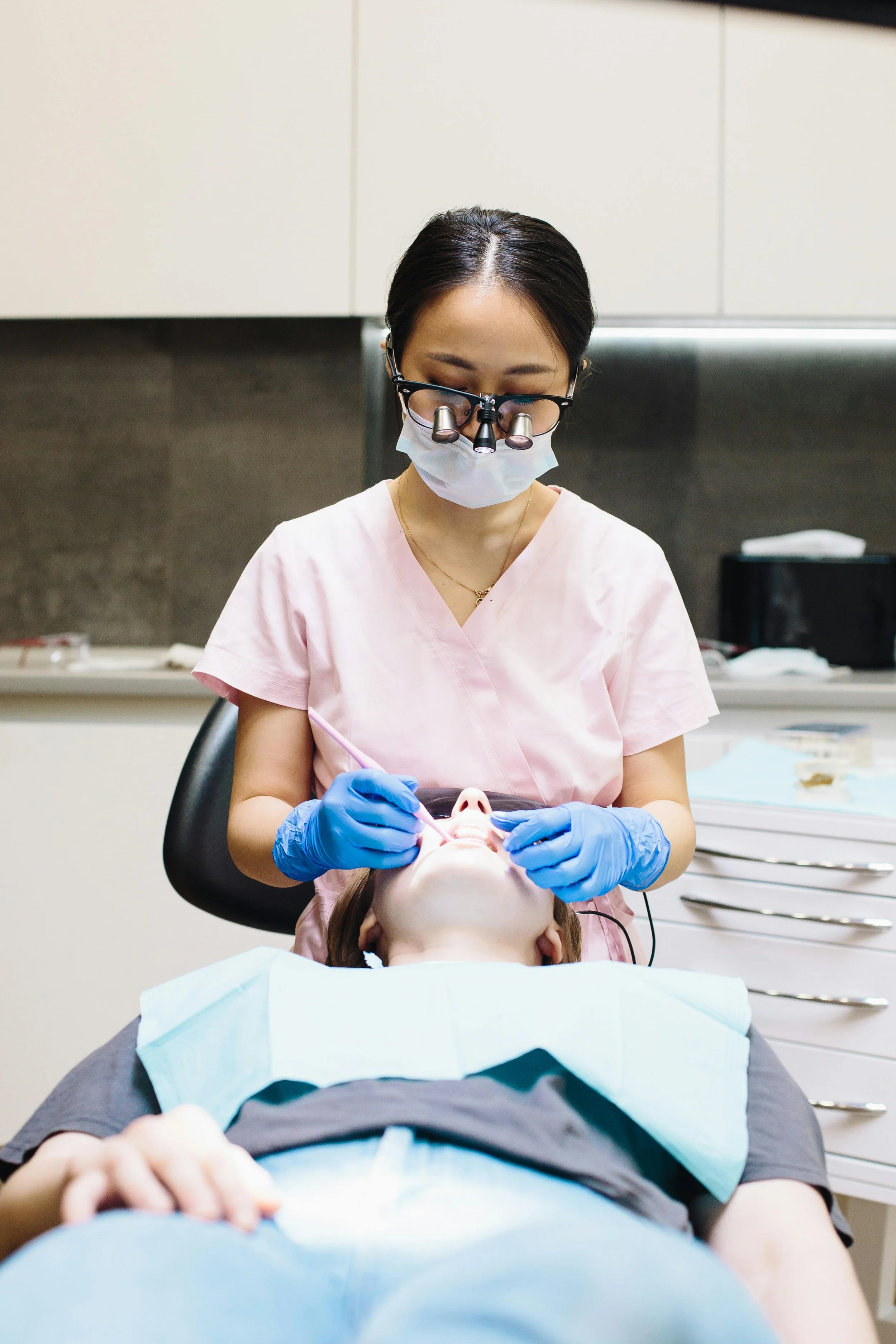 Female dentist delivering personalized dental treatment in a modern dental office