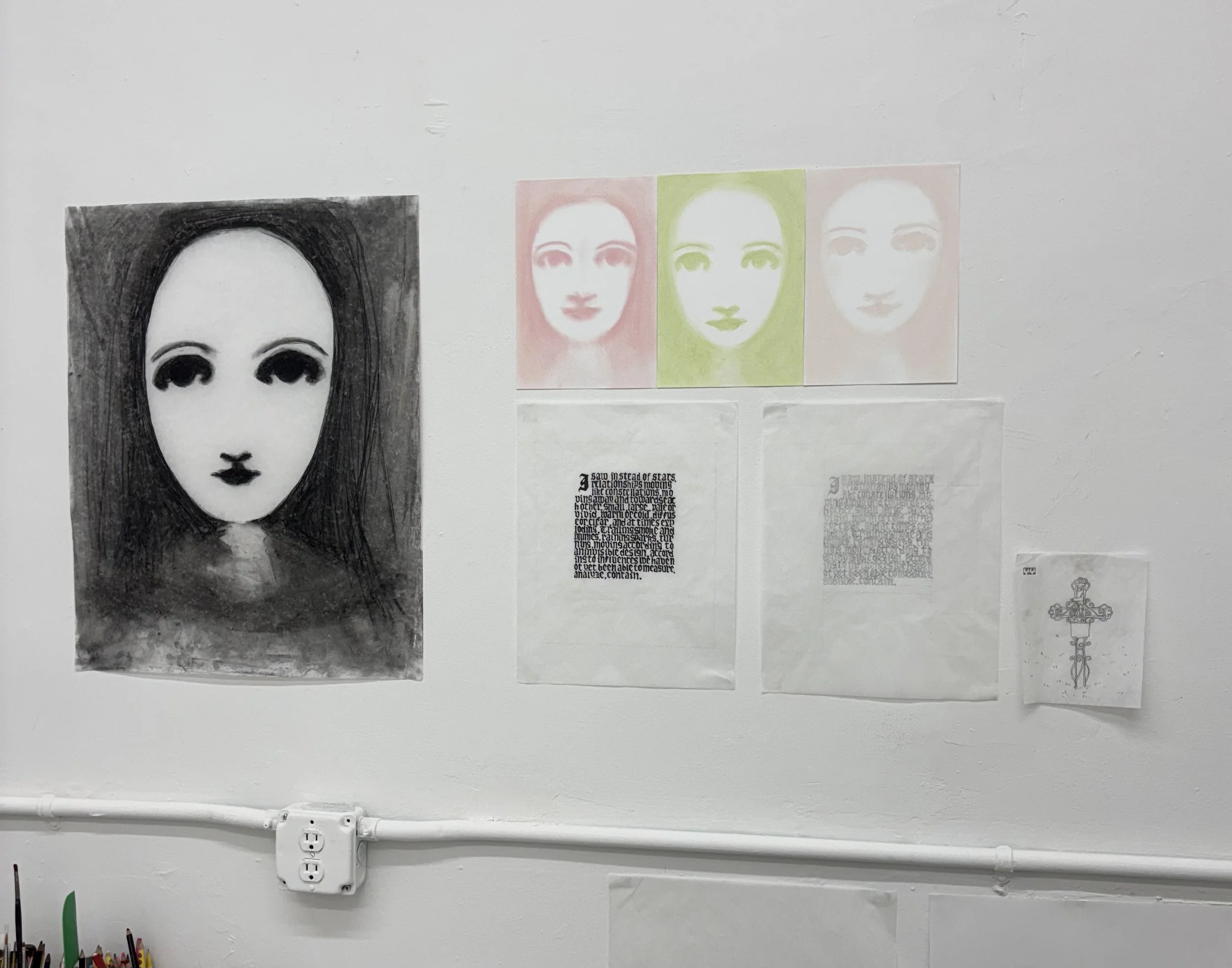 studio wall feat. her face, 18 x 24 in, charcoal on tracing paper (left) ∷ her face, 10 x 24 in tiled 8 x 10 in drawings, chalk on paper (right top) ∷ illuminated anaïs sketches, 11 x 14, graphite and ink on paper (right bottom)