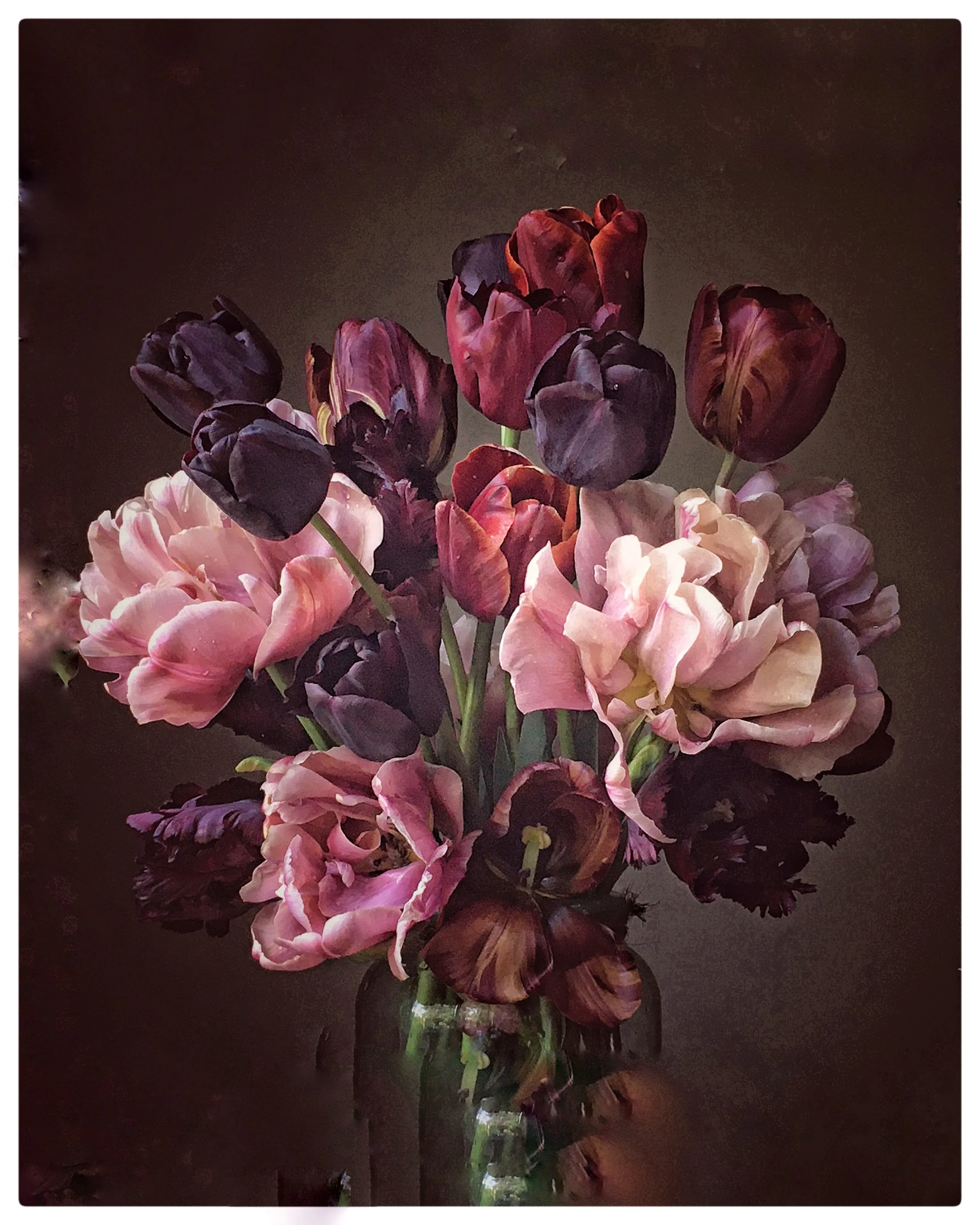 bunch of coloured flowers mainly tulips