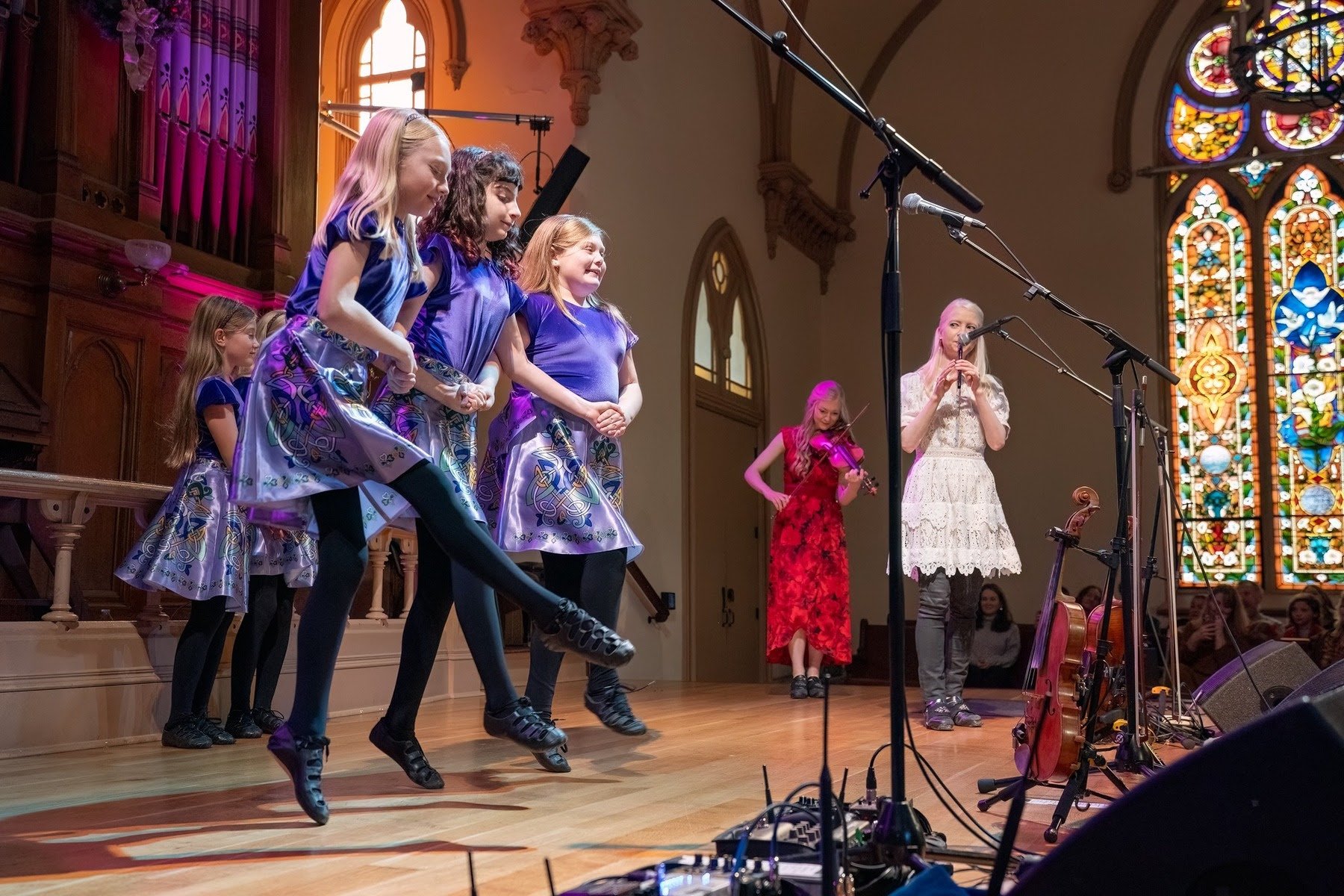 Dancers from the Oregon Irish Dance Academy perform onstage along with Willow and Solana Gothard from The Gothard Sisters during a Celtic Christmas concert at the Old Church Concert Hall in December 2025.