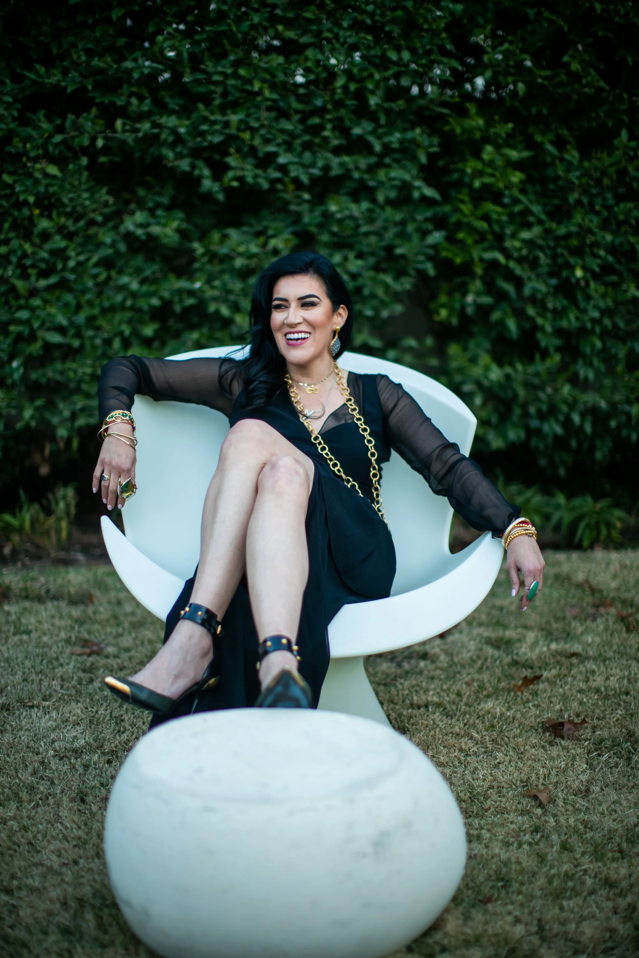 Headshot in circle chair.JPG