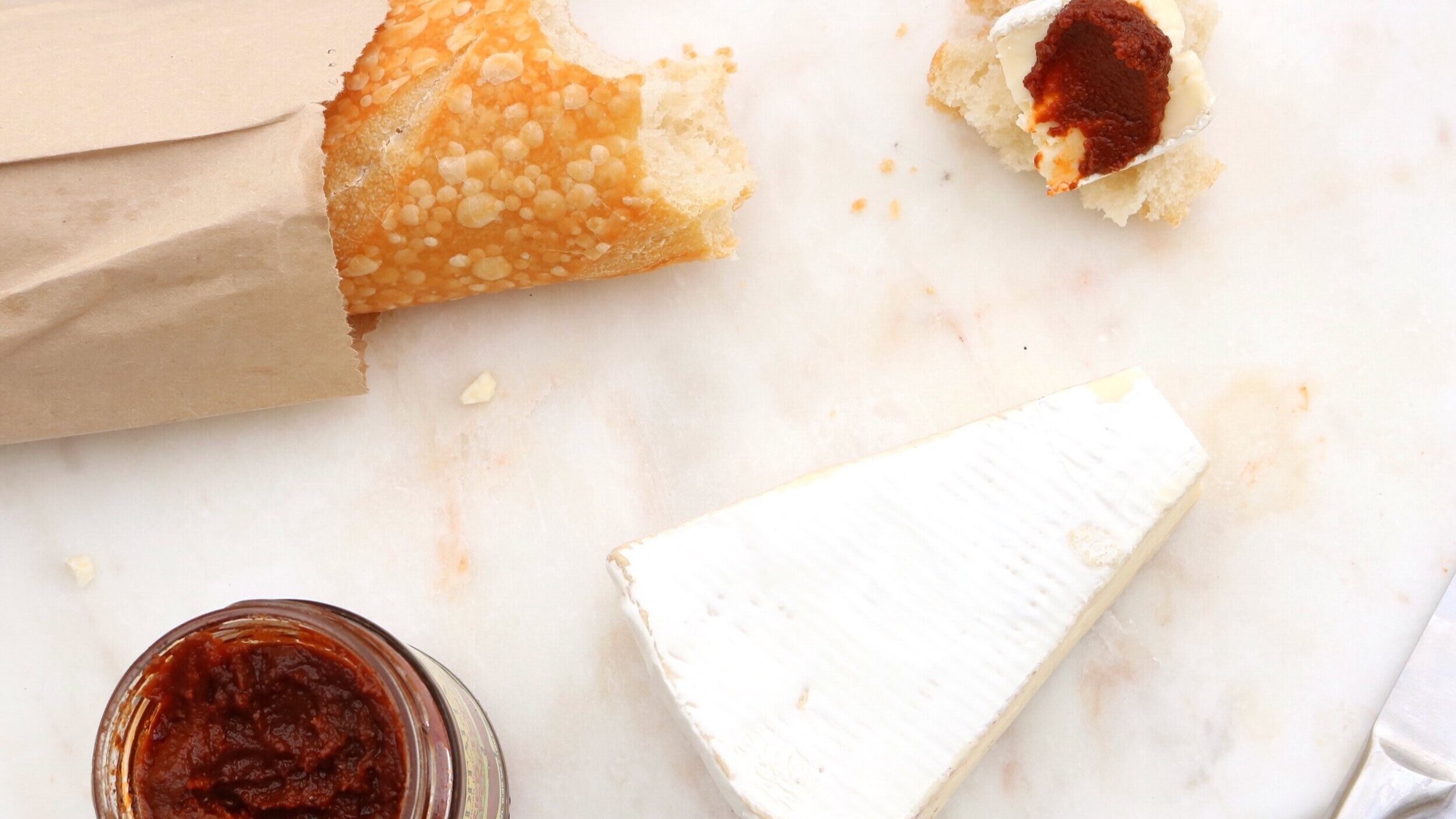 white-cheese-near-bread-with-a-bite-2632279.jpg