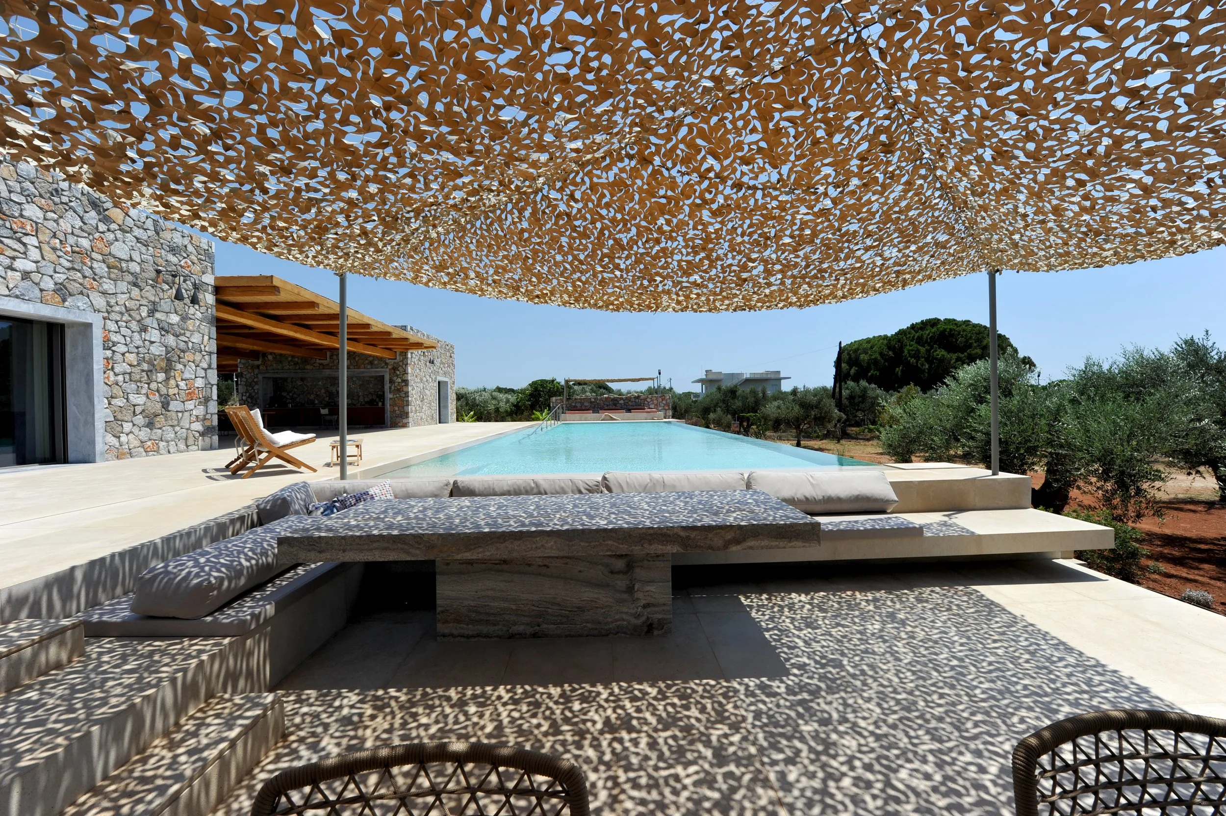 table by the pool in greece with sea view