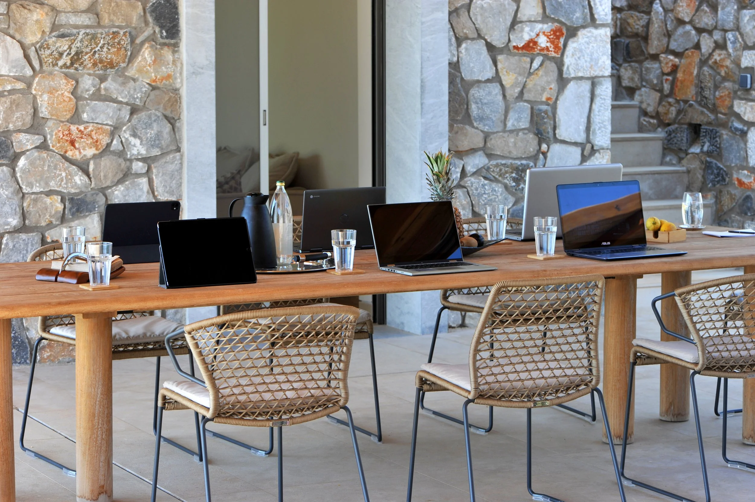 laptop work at villa in greece outside by pool