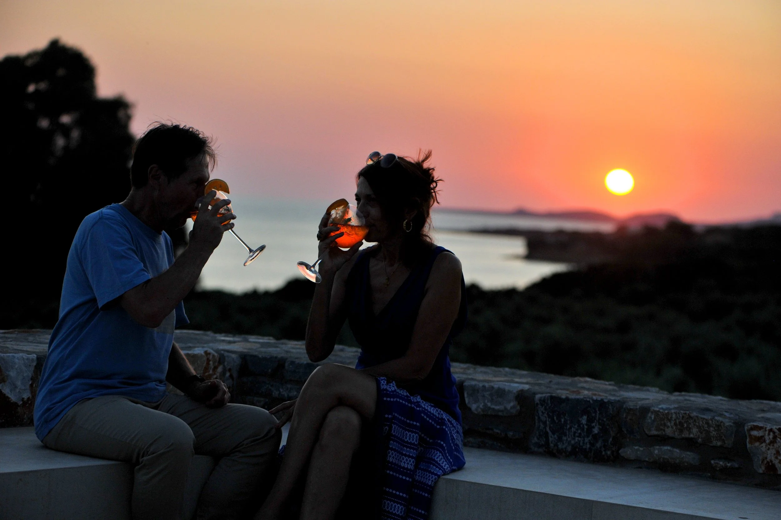 sunset by villa in greece and sea view