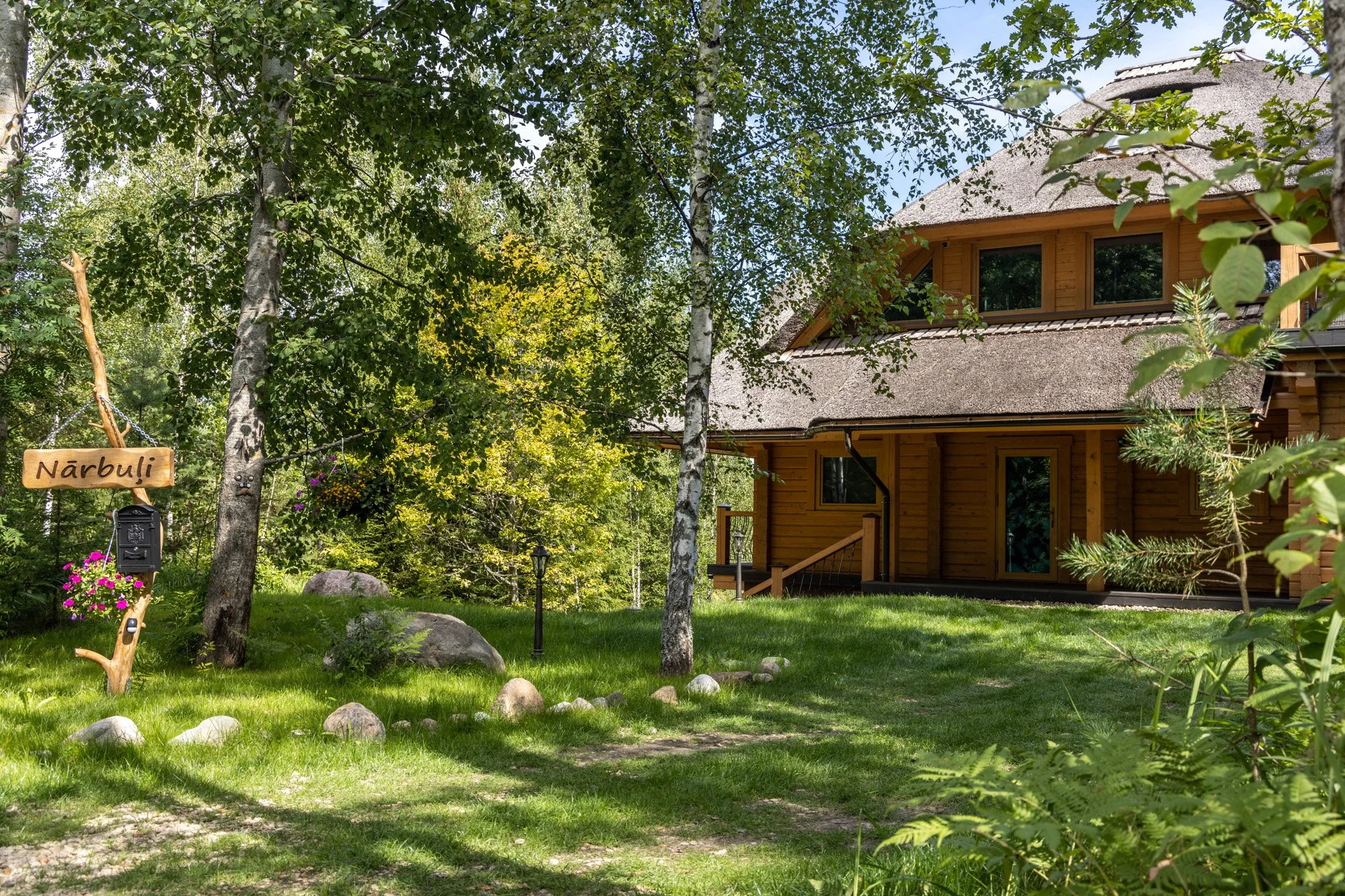 retreat house latvia garden and trees