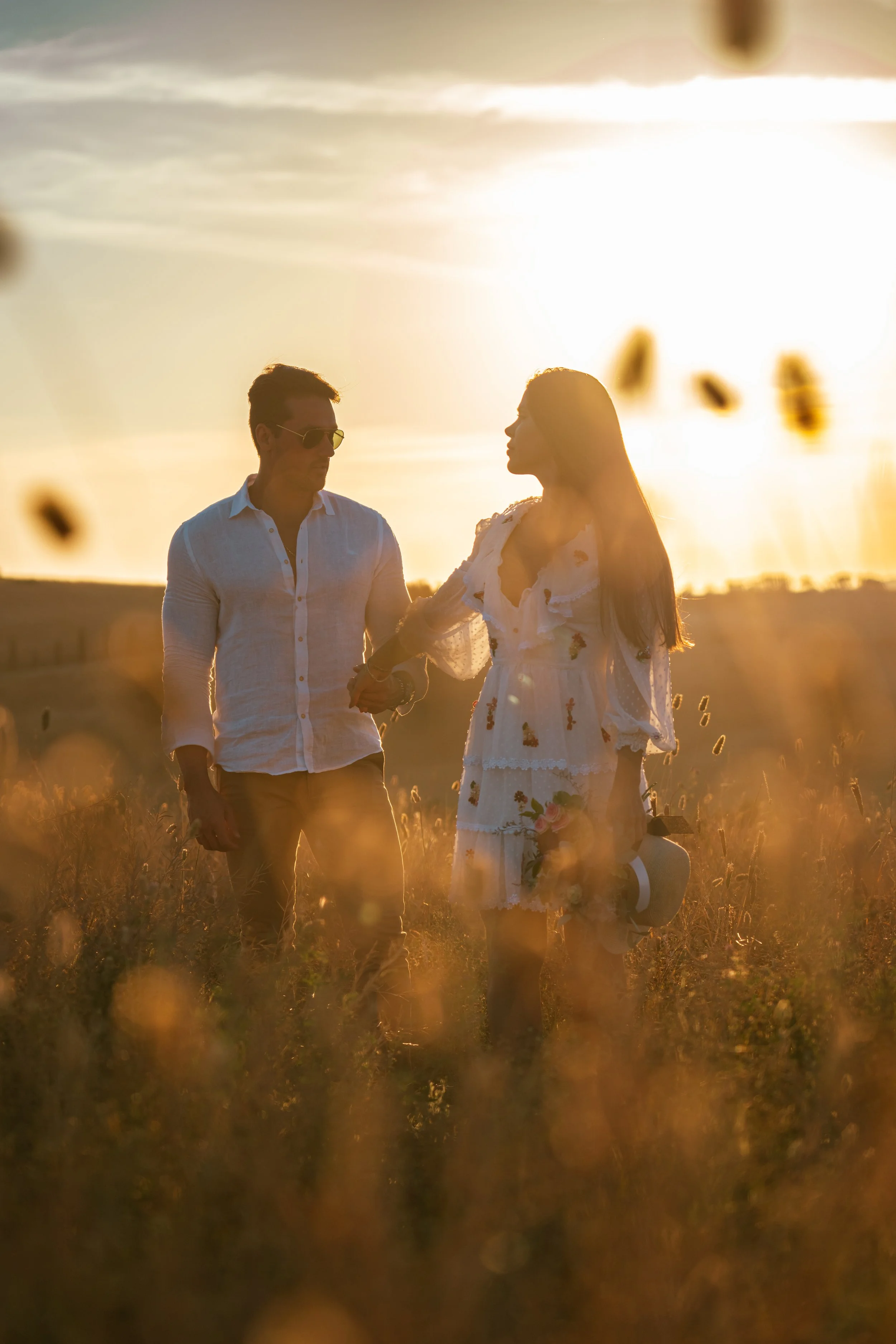Sunset romantic couple countryside hills in Tuscany