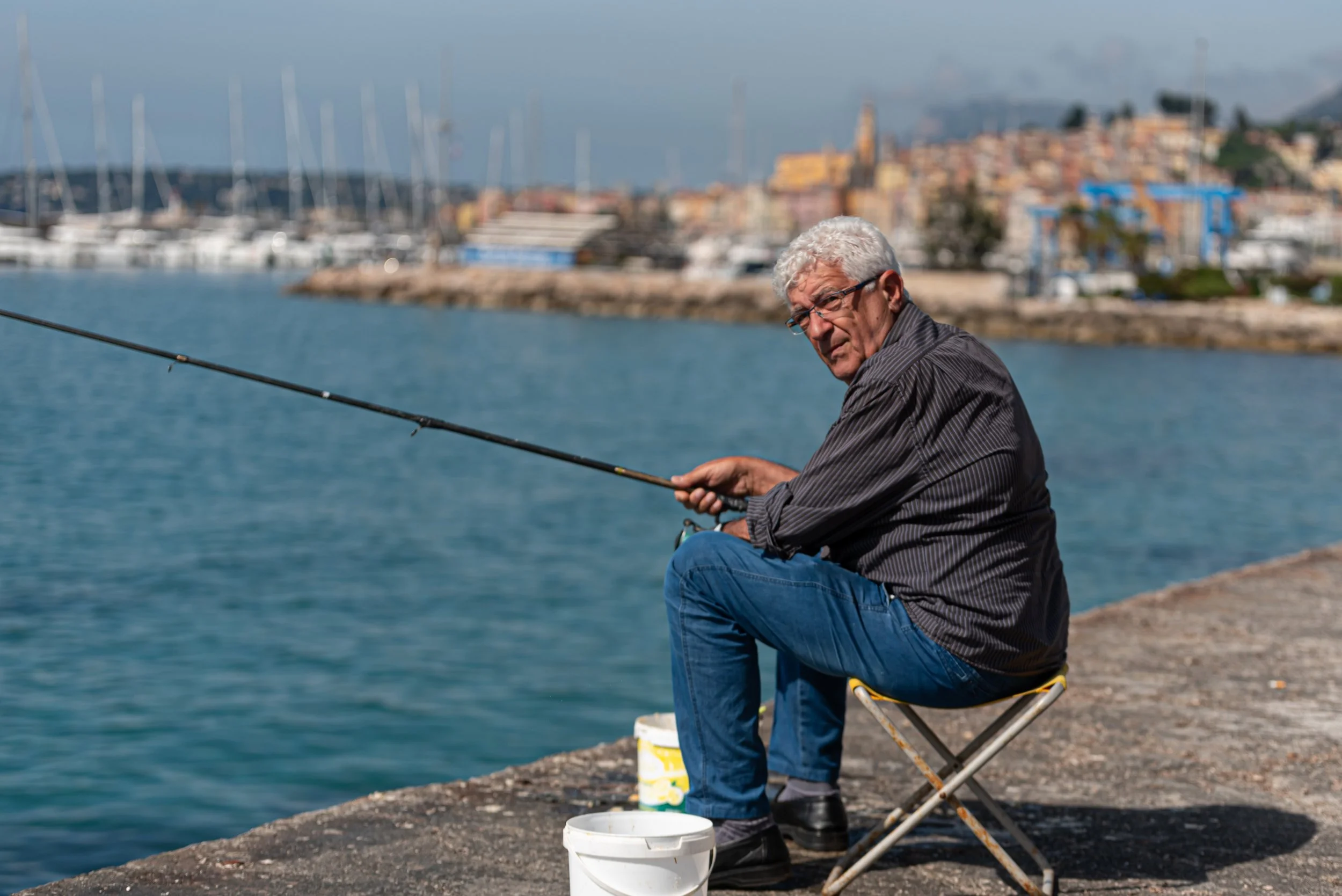 Mention has been a popular fishing spot for centuries. On my walk into town, at sunrise, I past this man fishing. Three hours later on my walk back I past him again. He obliged my photo request with a gallic shrug.
