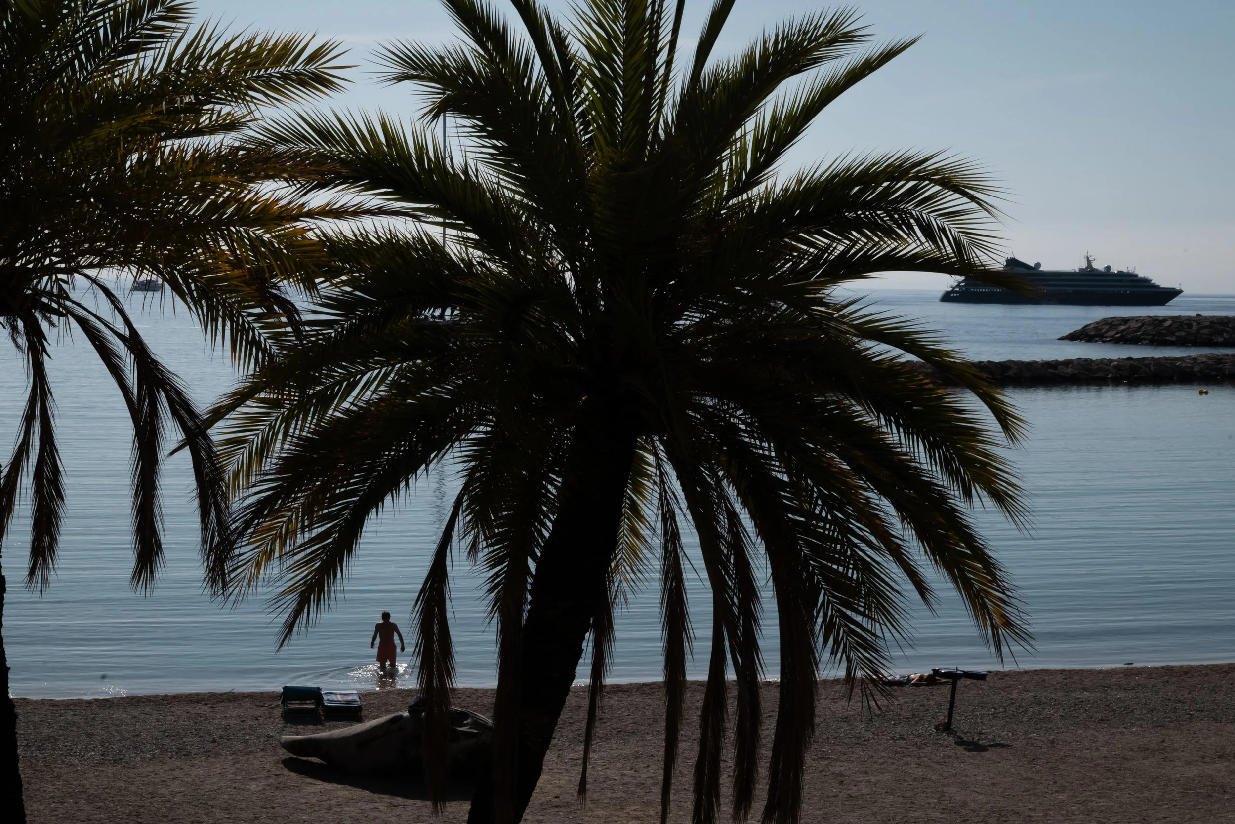 A man braving the cold, early morning sea. Menton.