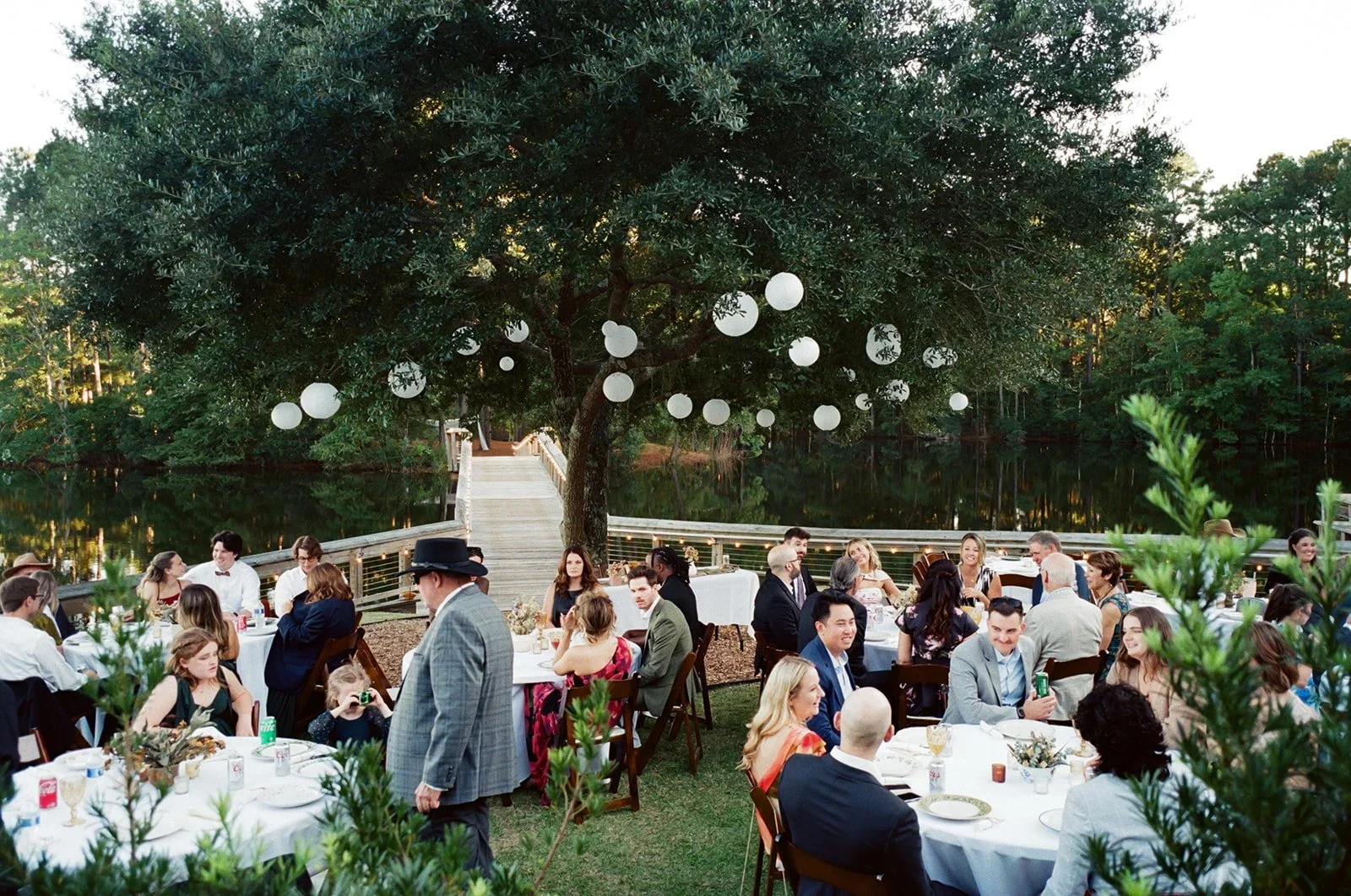 Wedding reception moments with guests photographed by wedding photographers in Raleigh NC.