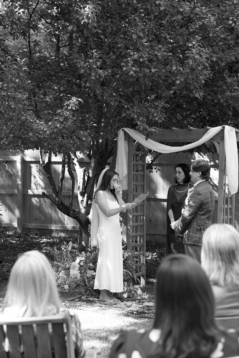 Woman crying as she reads vows for a wedding at The Goodyear House in Charlotte