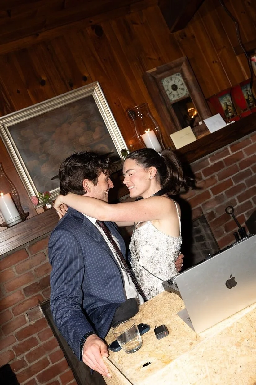 Bride being the DJ with groom celebrating with her at their micro wedding in North Carolina