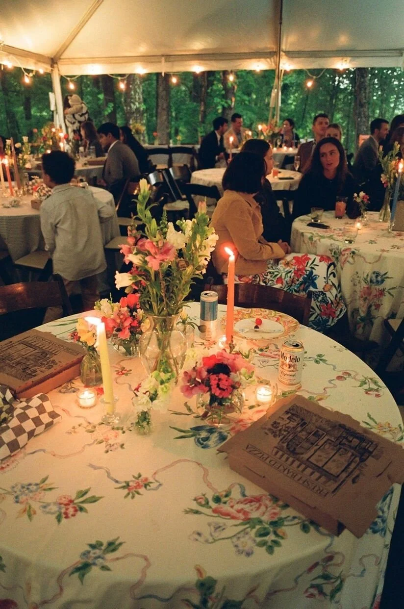 Charming reception decor under a canopy with fresh flowers at a micro wedding in North Carolina