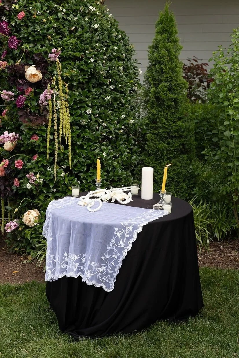 Two candles on table at a ceremony at The Matthews House in Cary
