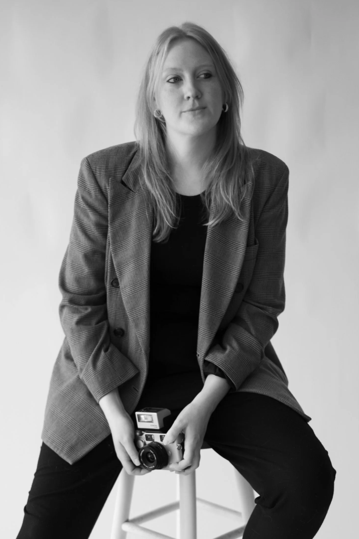 Raleigh wedding photographer, Melissa, from the Photo Brief, holding her camera