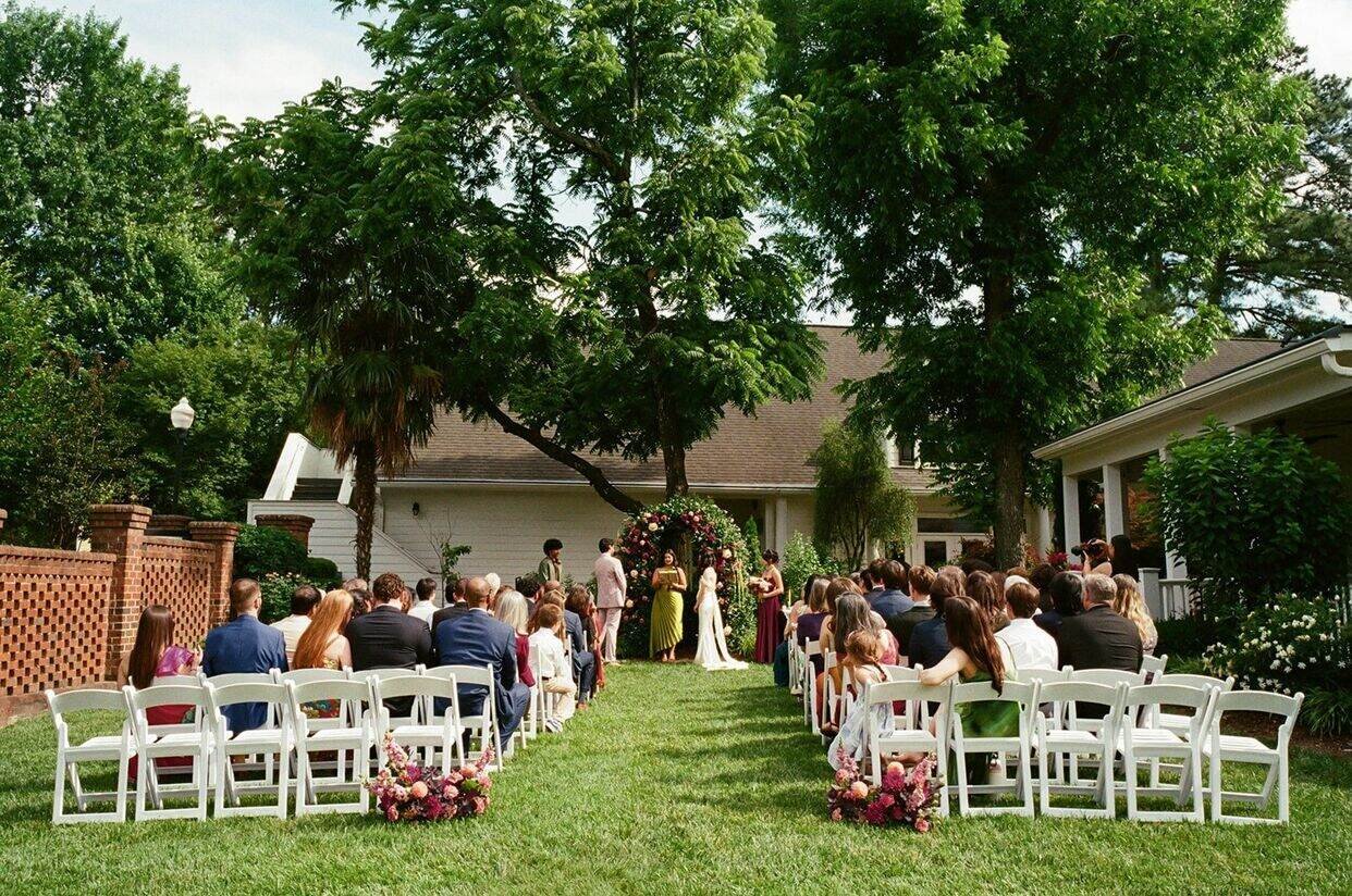 Beautiful ceremony outside at The Matthews House in Cary, NC.
