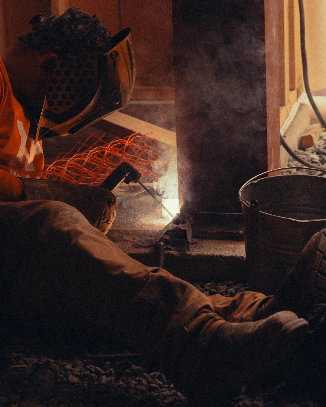 Fun Fact: Our shop and on-site welding processes often differ, with on-site work relying heavily on stick welding! During our recent installation at the Lakeside Project, Adam is welding the column to the base plate using a stick welding tool. Stay t