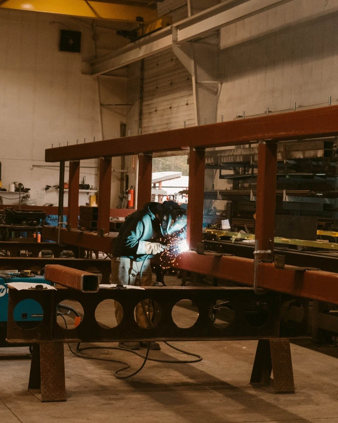 A little glimpse into the fabrication of a 100-foot long by 25-foot high truss, made possible by our skilled fabricators, powerful crane lift, and large workshop. This beast was fabricated right here in our Pemberton shop and carefully transported do