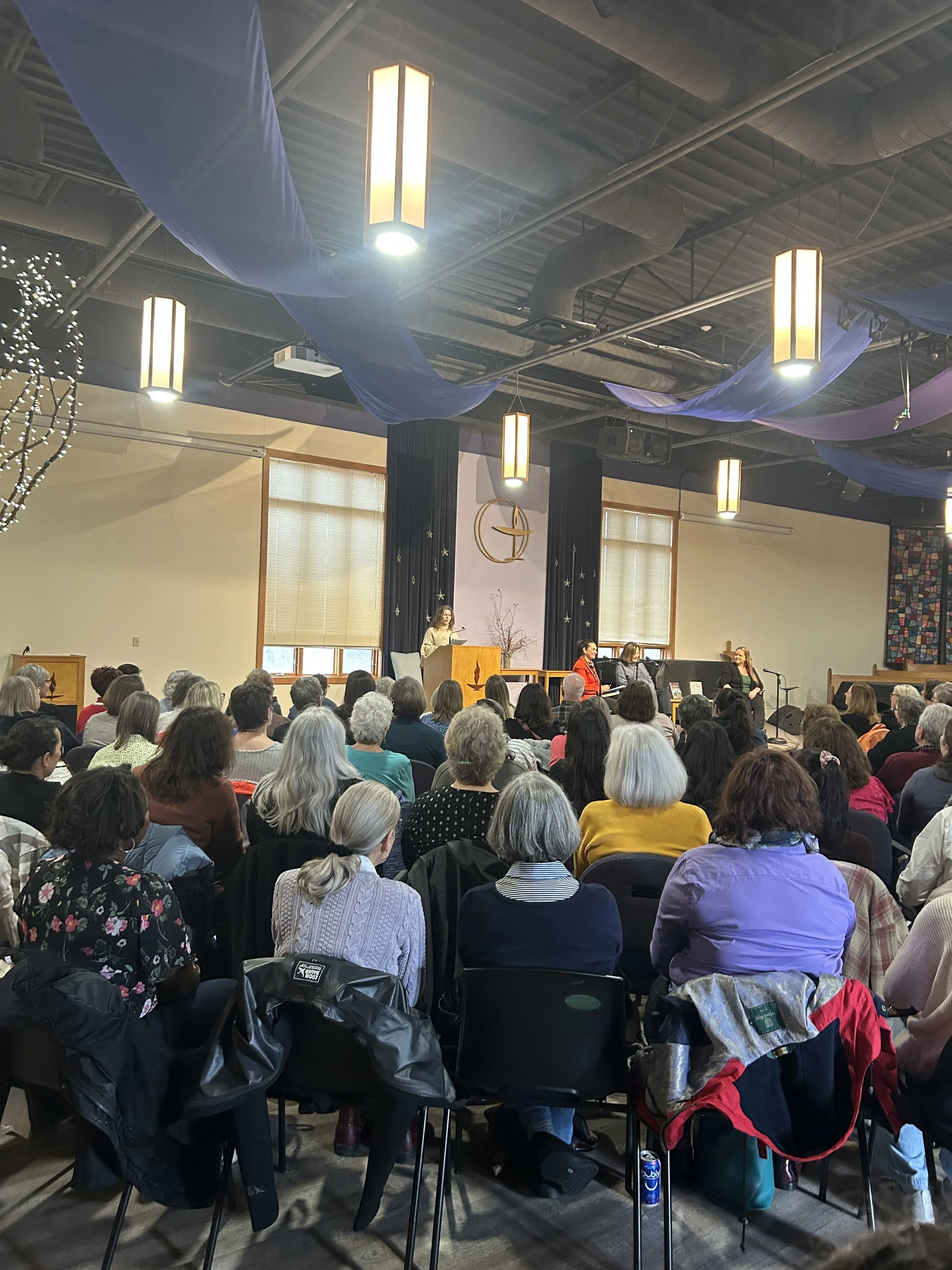 A crowd listens to the introductory remarks of a book event in Hamilton Ontario during a gritLIT event.