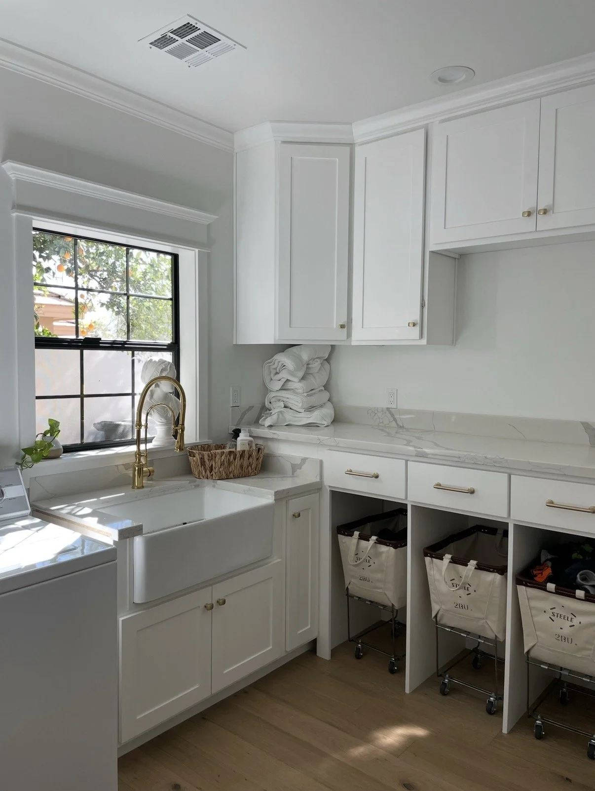 Mudroom with different counters, no fridge.
