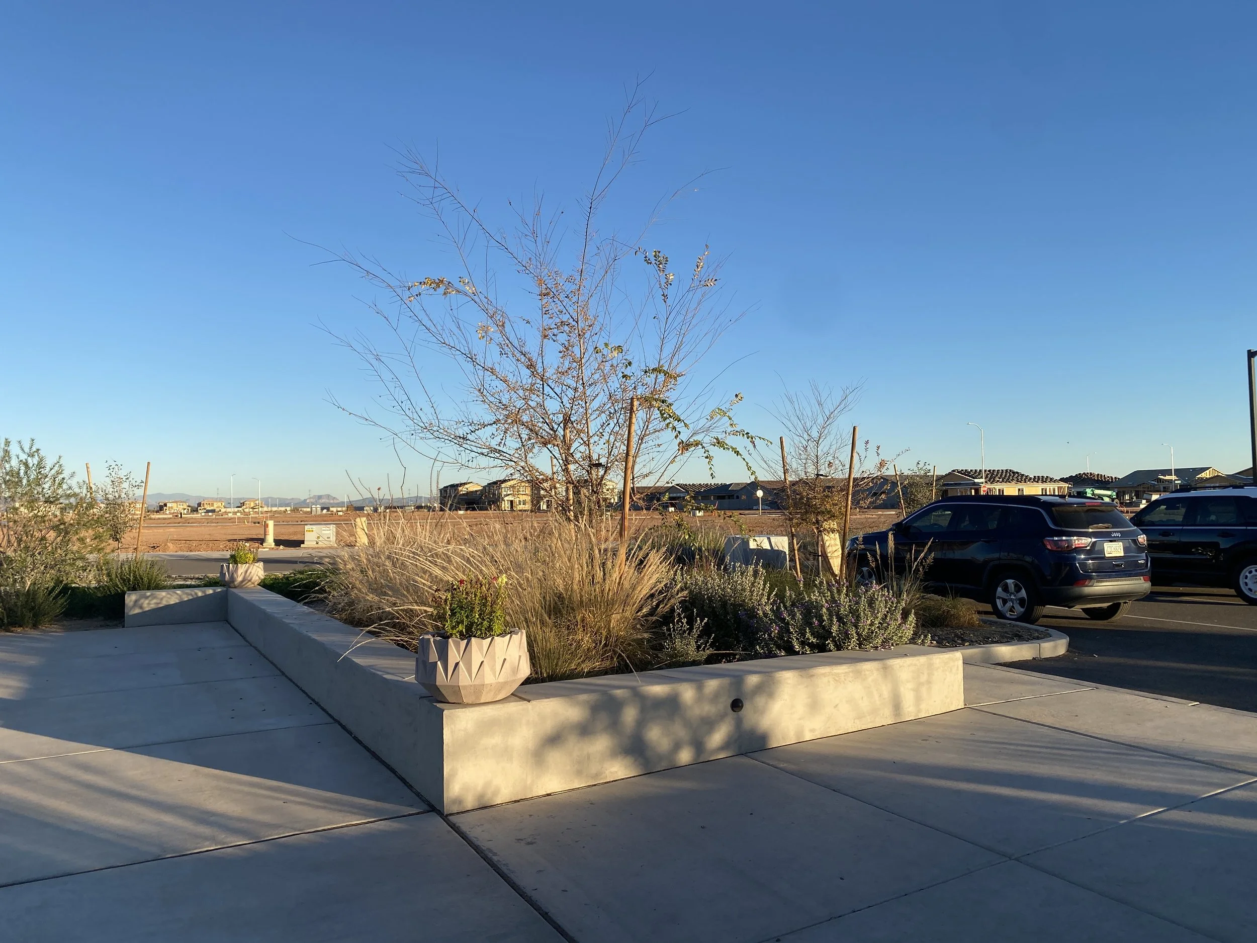 Parking lot steps away from framed houses