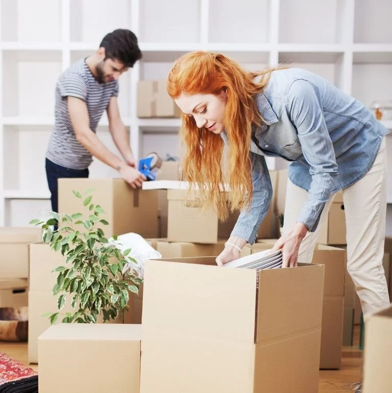 new-beginings-couple-unpacking-at-home-royalty-free-image-472129089-1566229327.jpg