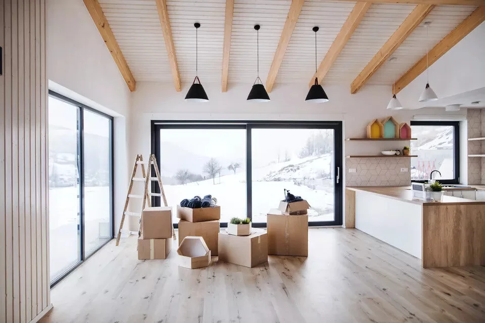 moving-boxes-in-modern-living-room-in-a-new-home--1160208532-60b1ee1e5e99439a8bb5baa13000ede9.jpg