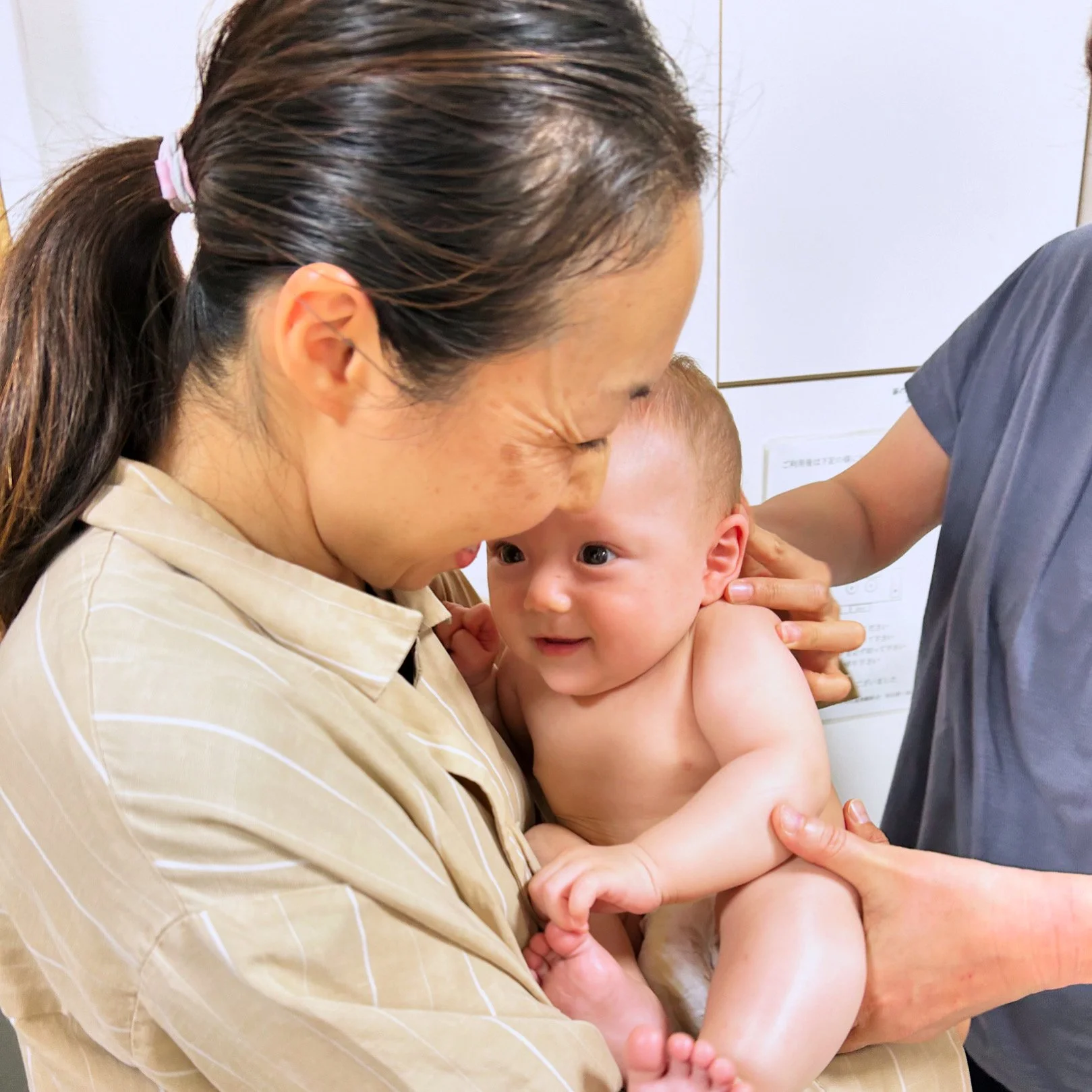 woman holding a newborn baby functional medicine