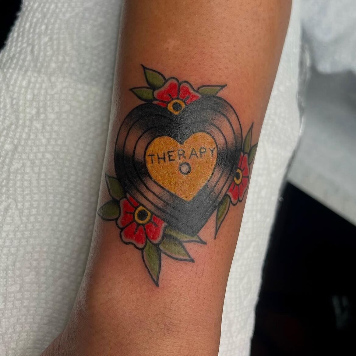 Groovy heart record done by @crybbyink 🎵❤️

Maeve is taking walk-ins all March long! You can also head on over to thirdseasontattoo.com to set up an appointment with her as well! 

#tattoo #tattooartist #tradtionaltattoo #tradtattoos #traditionaltat