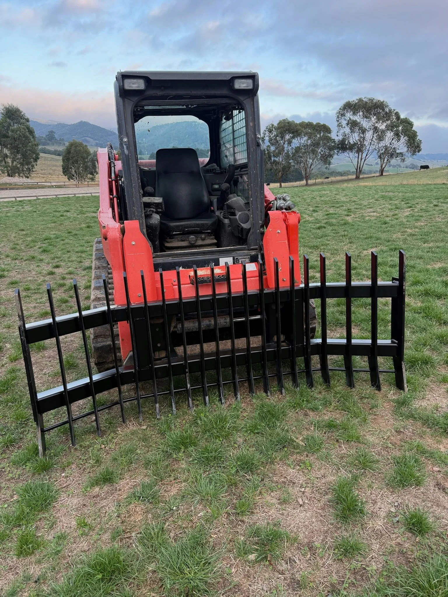 Kubota with stickrake svl75