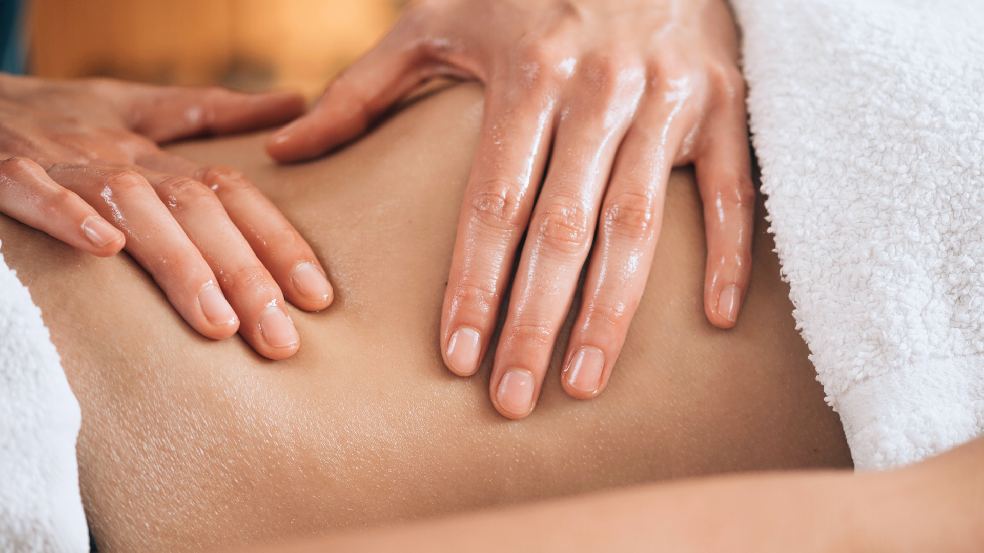 Person receiving a back massage in a spa or massage parlor